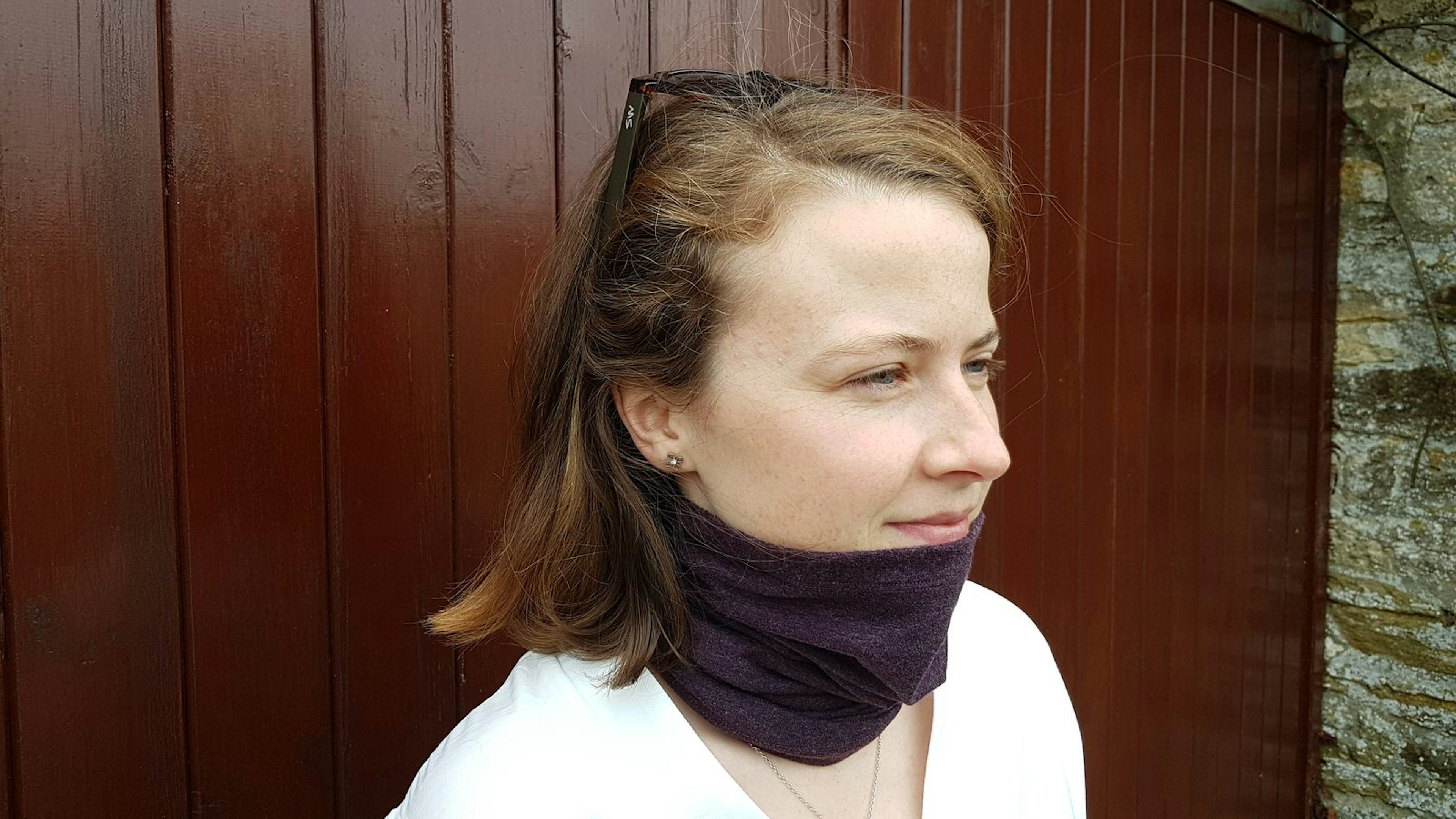 The Luxe Bamboo Neck Tube from BAM, shown in purple and worn by a female model