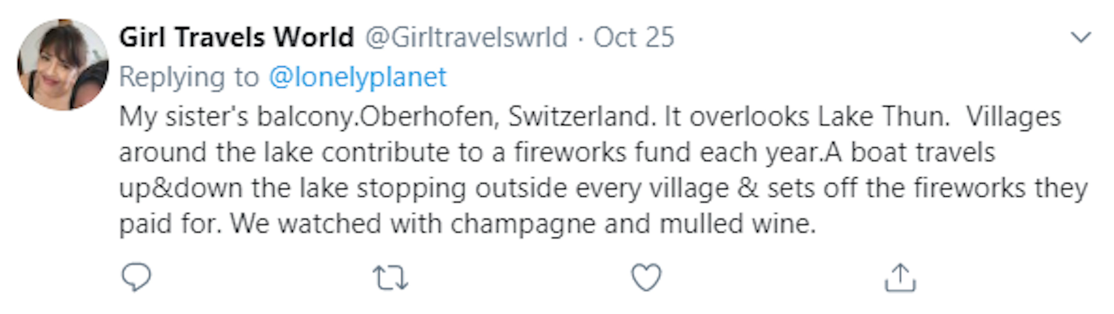 A screenshot of a Twitter comment by Girls Travel World. It reads: My sister's balcony.Oberhofen, Switzerland. It overlooks Lake Thun. Villages around the lake contribute to a fireworks fund each year.A boat travels up&down the lake stopping outside every village & sets off the fireworks they paid for. We watched with champagne and mulled wine.