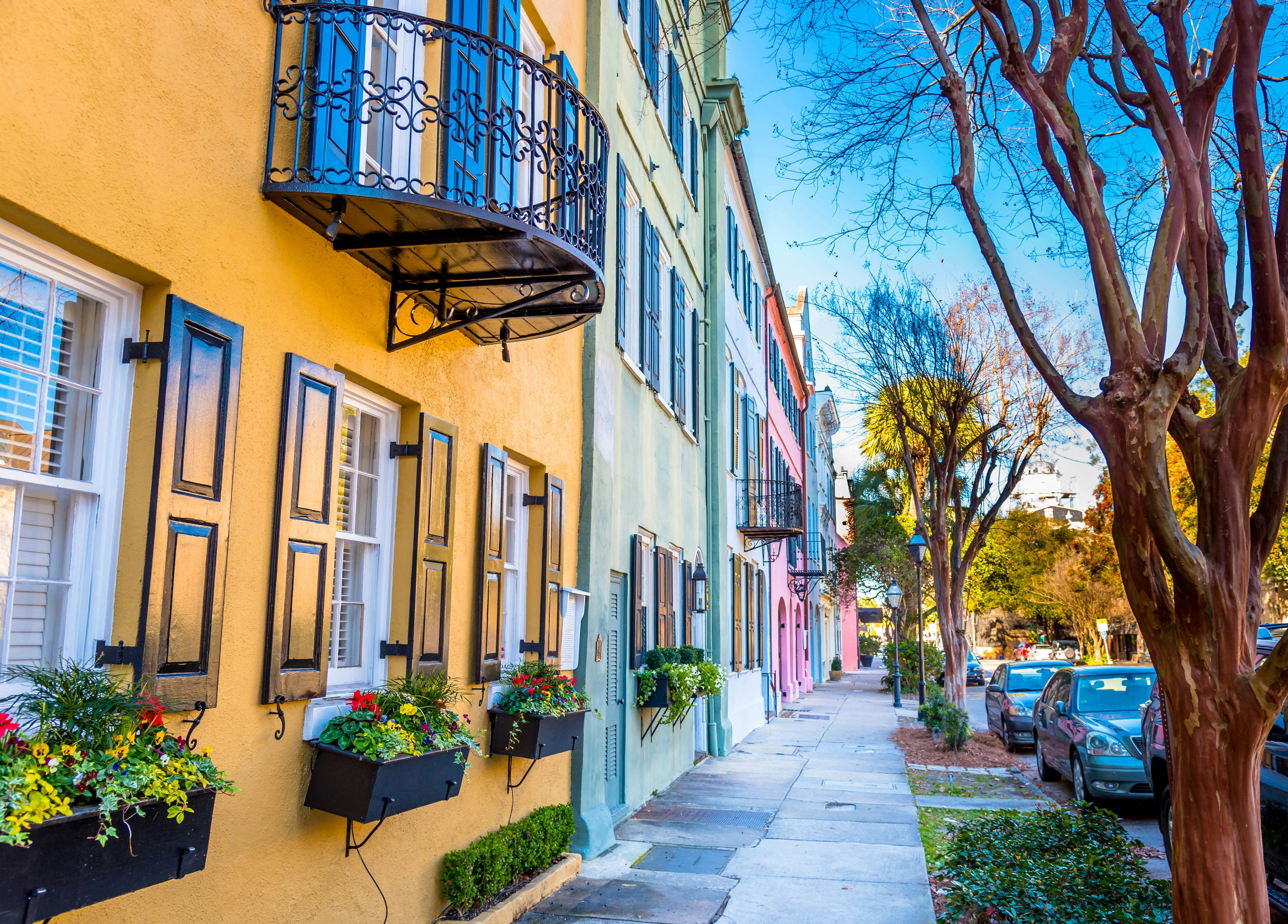 A row of houses all painted in different pastel colors