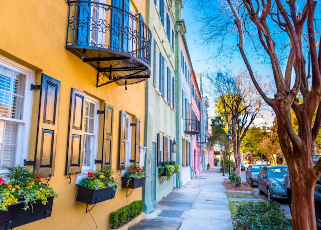 A row of houses all painted in different pastel colors