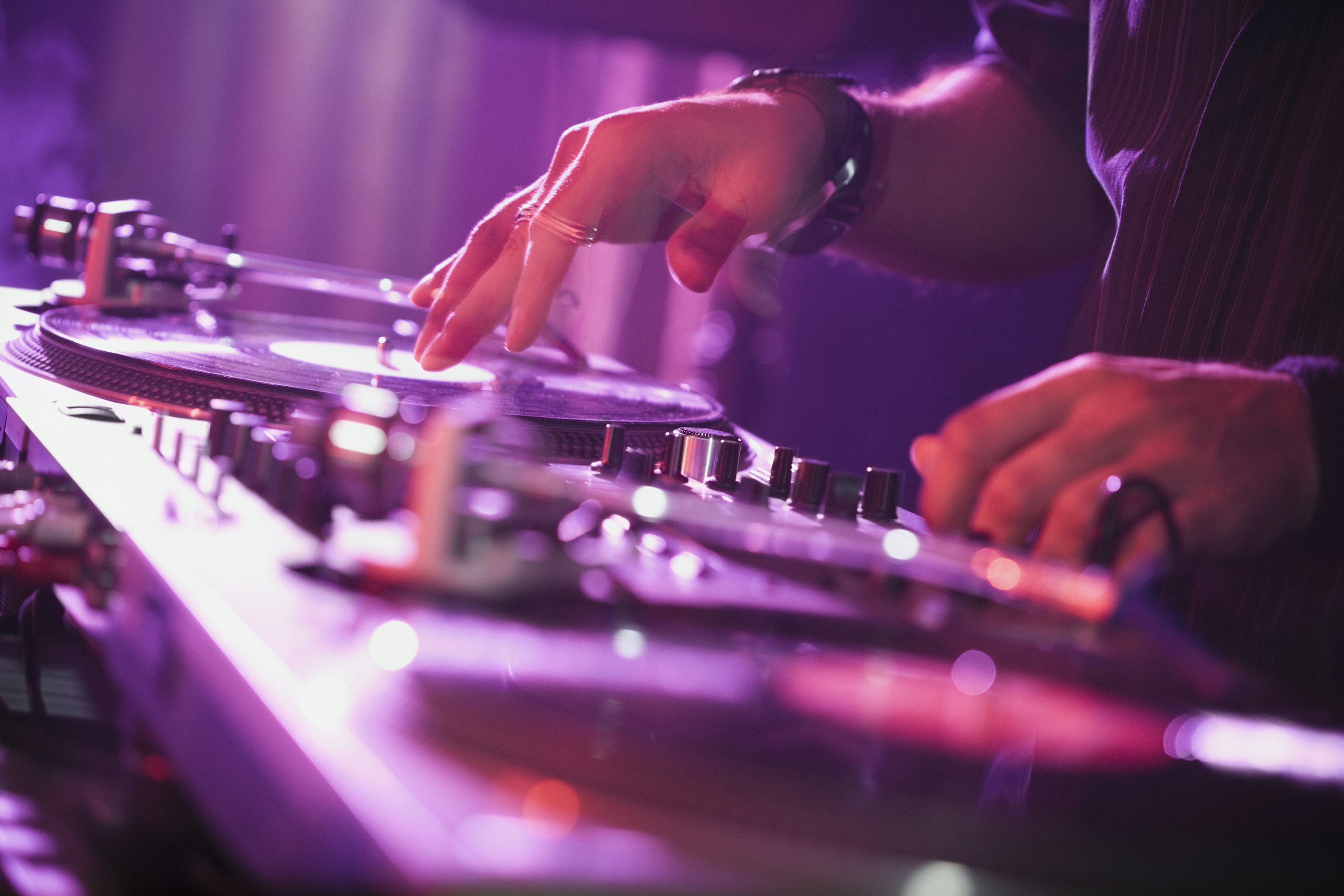 A DJ plays on a turntable.