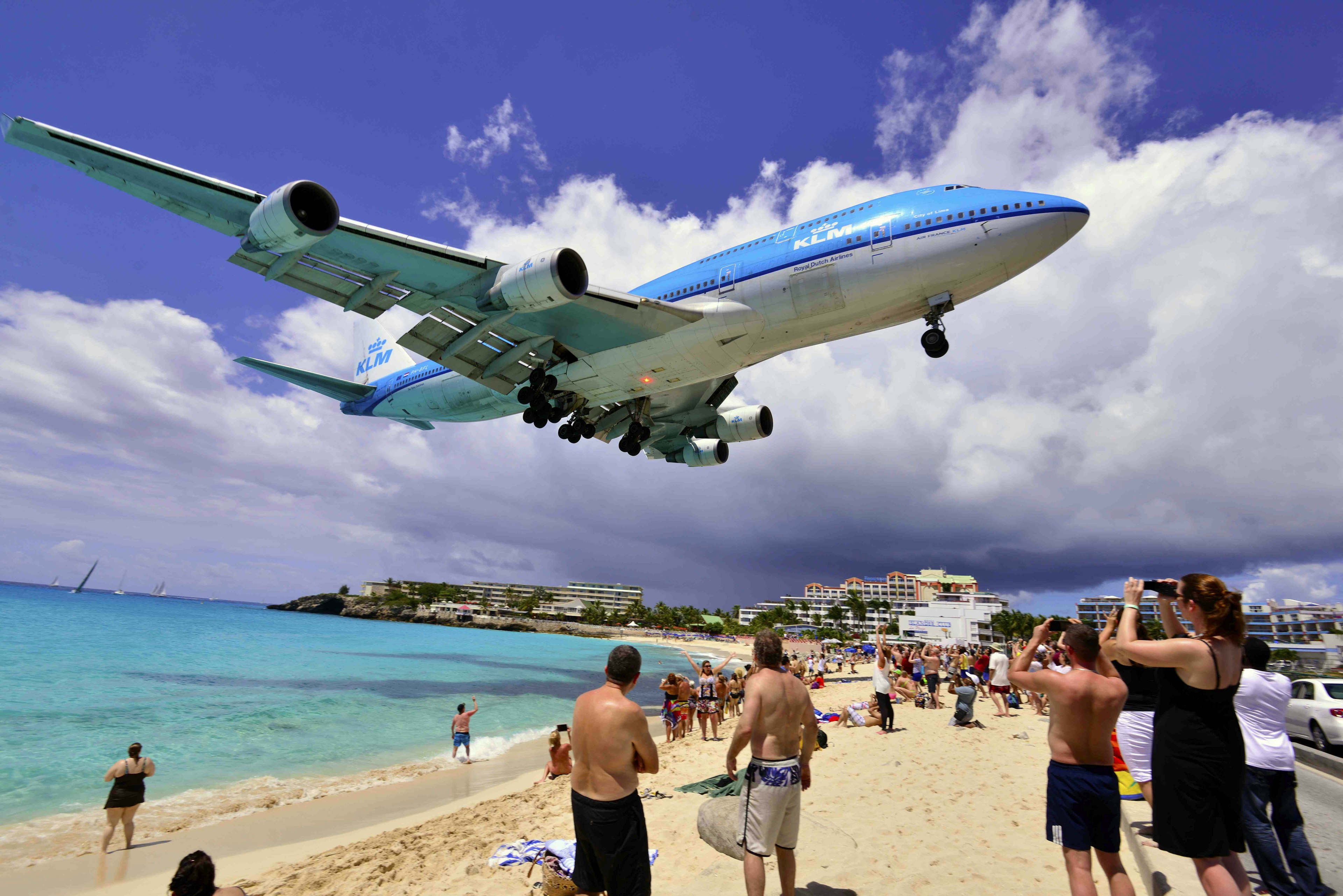 A commercial airplane flying low over Simpson Bay, Saint Martin.