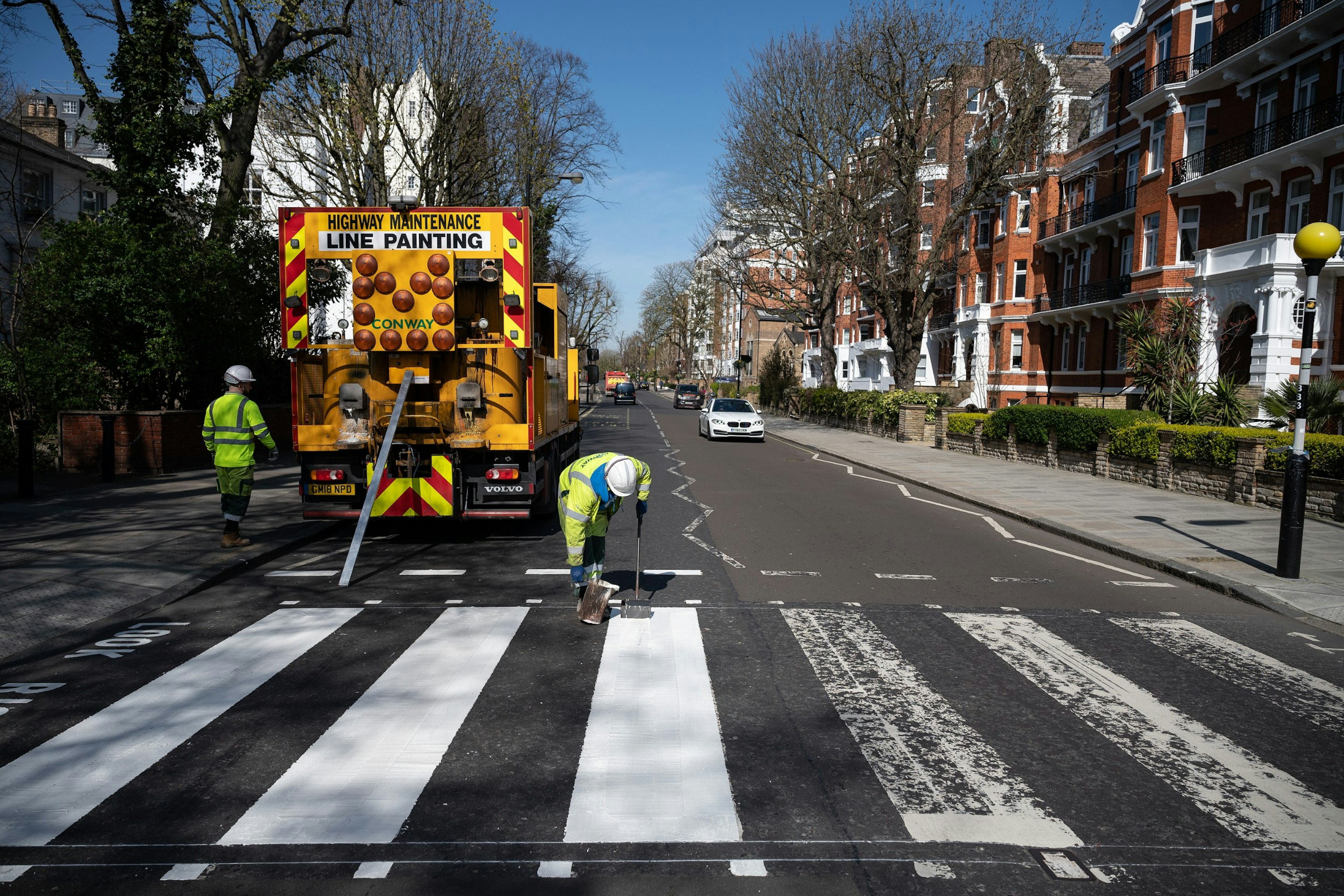 A Highways Maintenance team takes advantage of the COVID-19 coronavirus lockdown to re-paint the iconic Abbey Road crossing.jpg