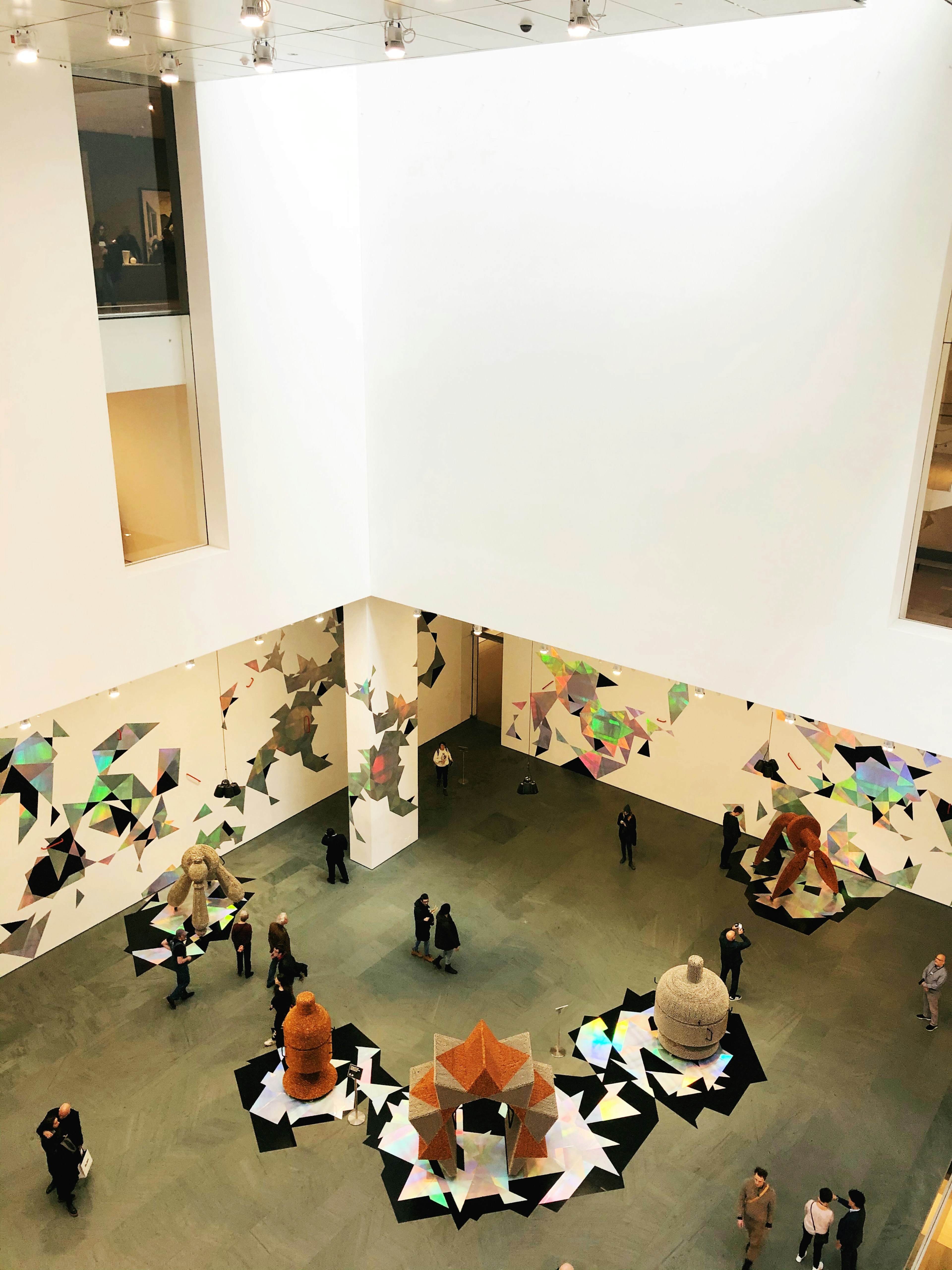 Looking above the gallery goers inside the renovated Museum of Modern Art