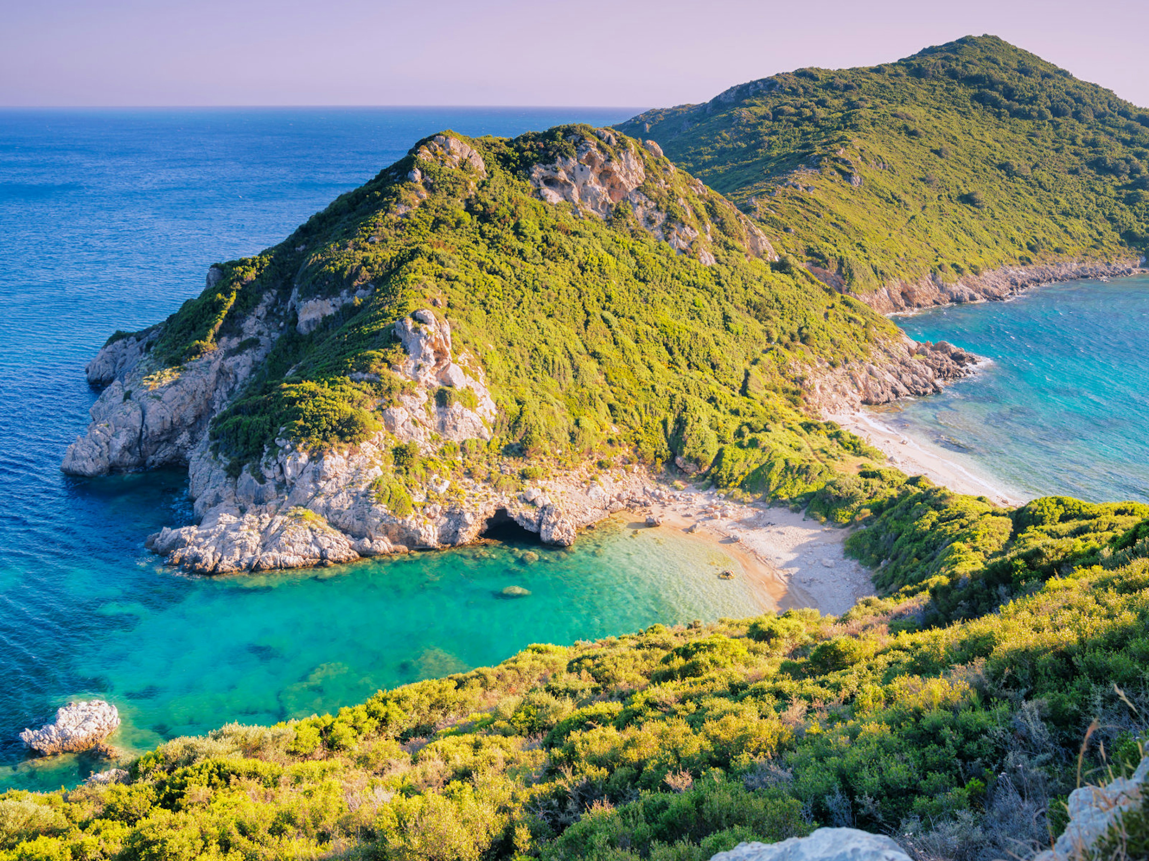 ǰڳ’s Agios Georgios beach at sunset © Elena Pavlovich / Shutterstock