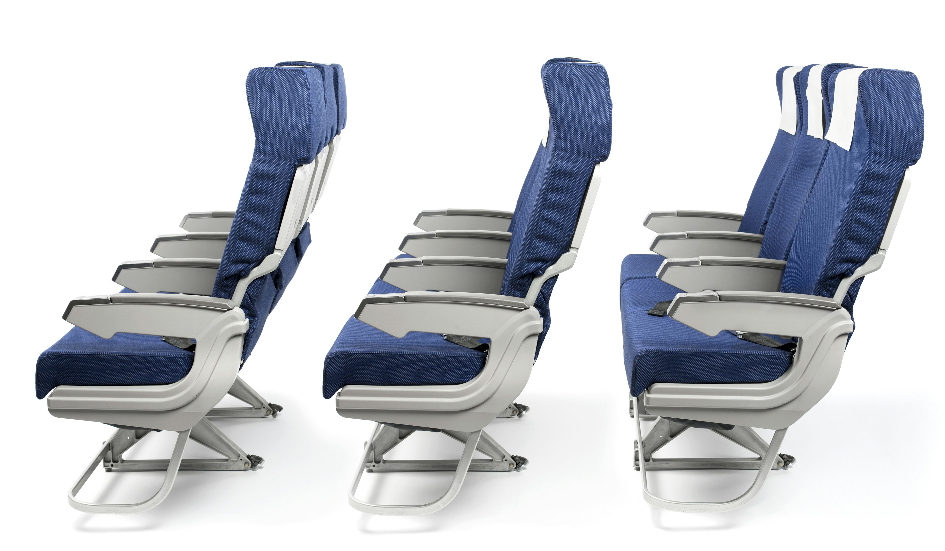 Three rows of blue airline seats over a white background. The seats have grey armrests and blue fabric elsewhere.