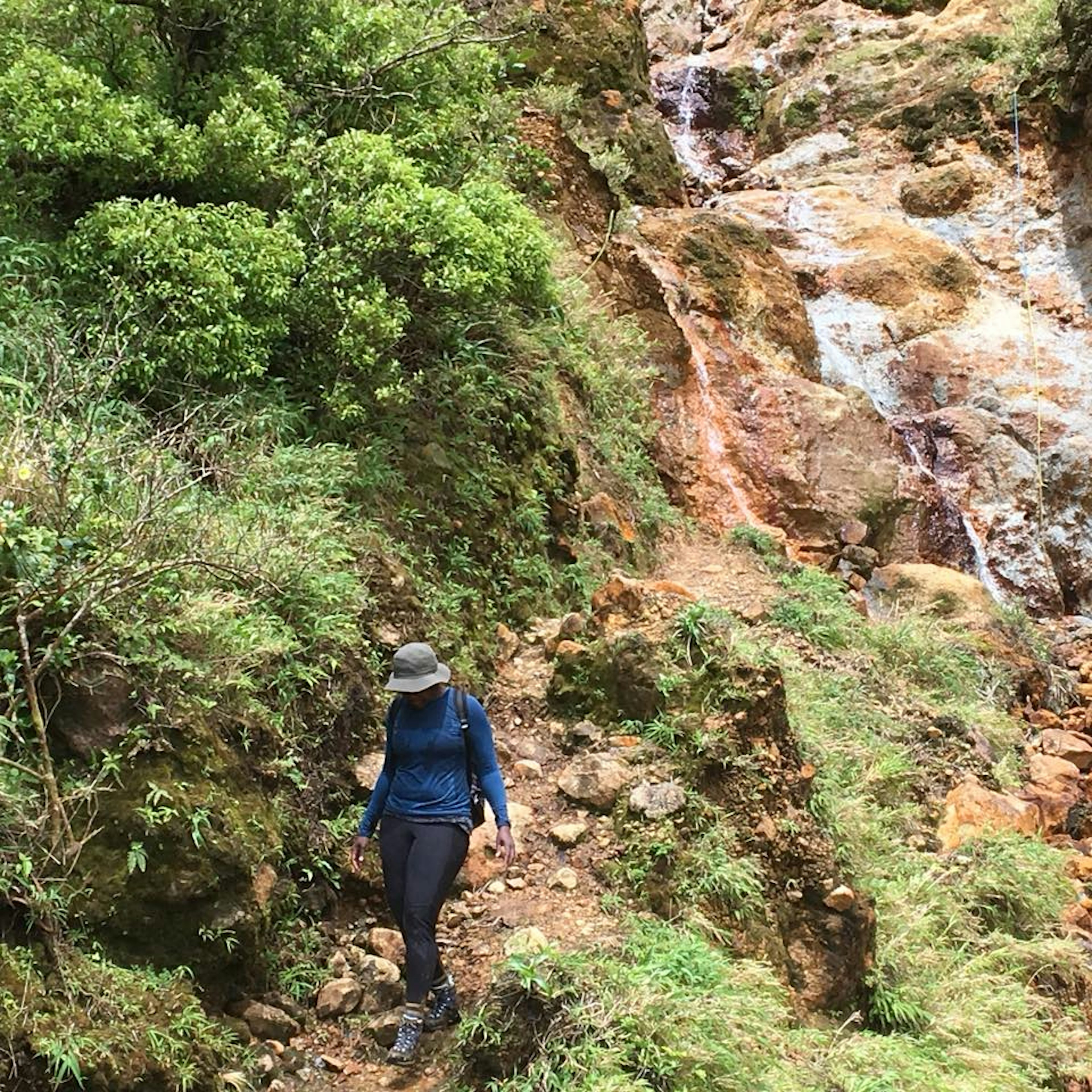 Digital editor Alicia Johnson in Dominica wearing her REI bucket hat