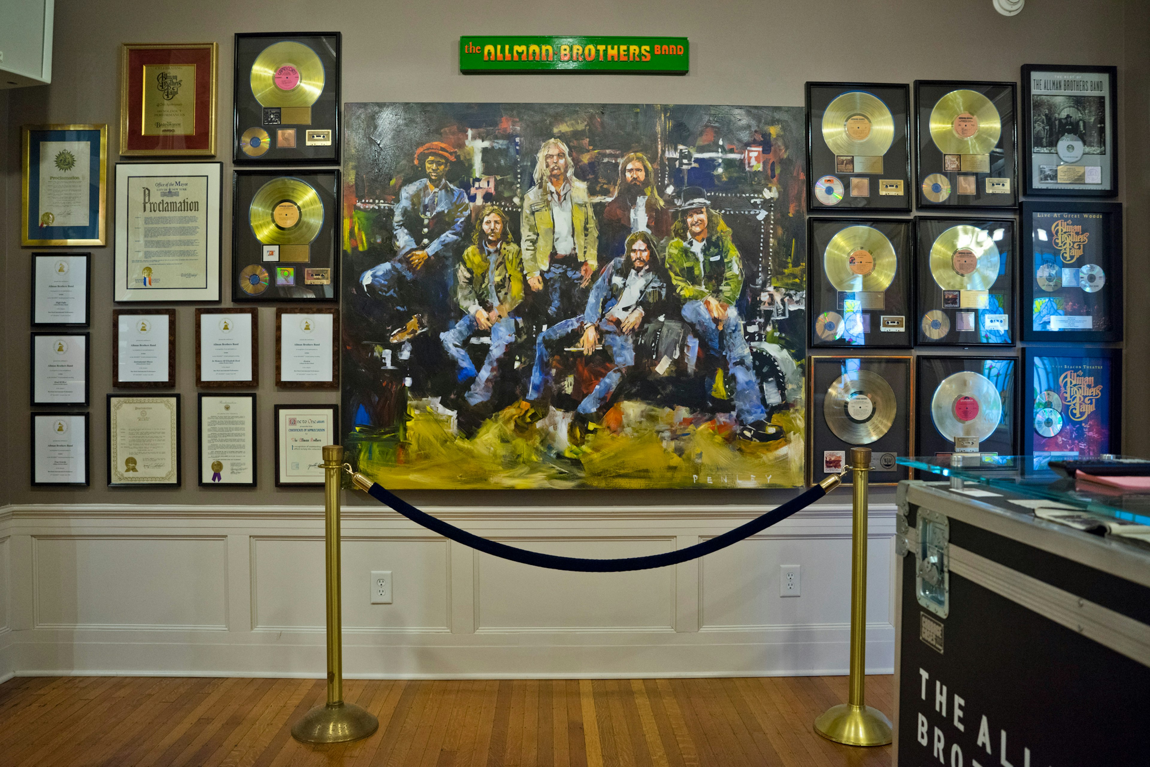 A large image of the Allman Brothers and gold records line the interior of the museum; USA museums for music lovers