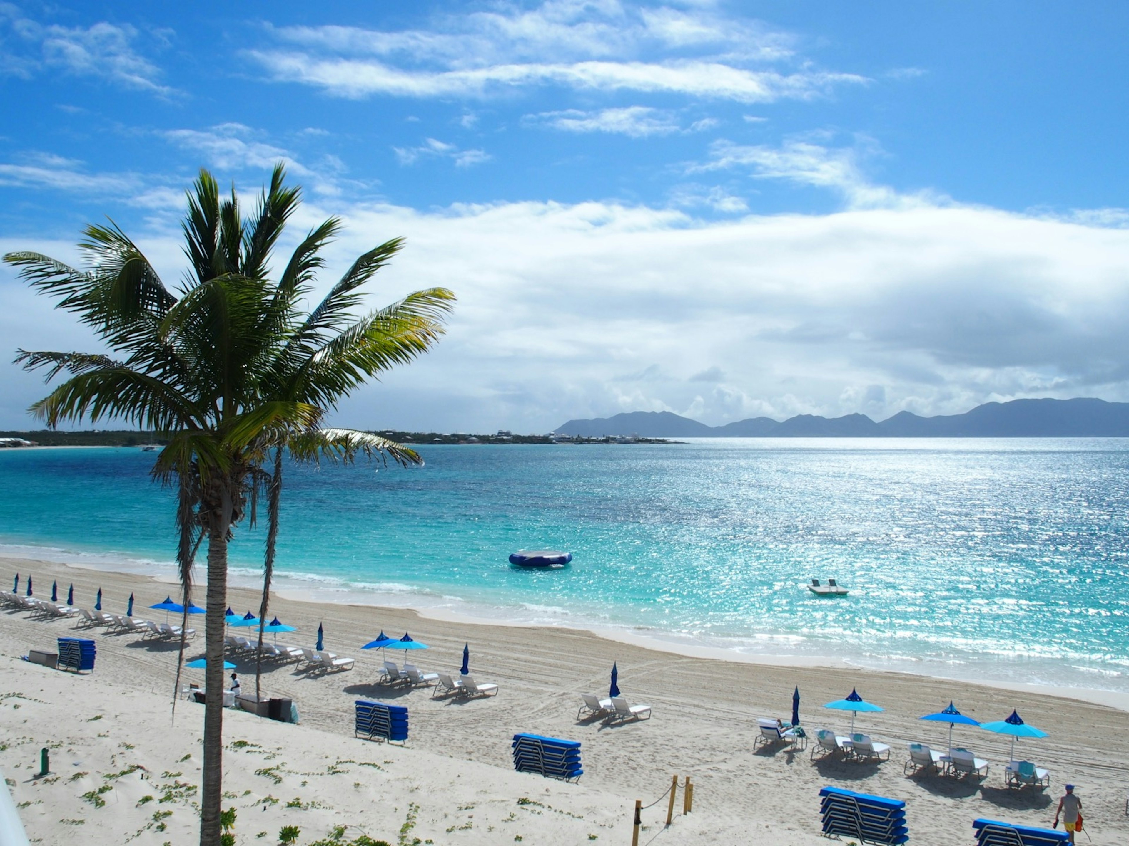 Sun rays glisten off the turquoise waters of Rendezvous Beach in Anguilla