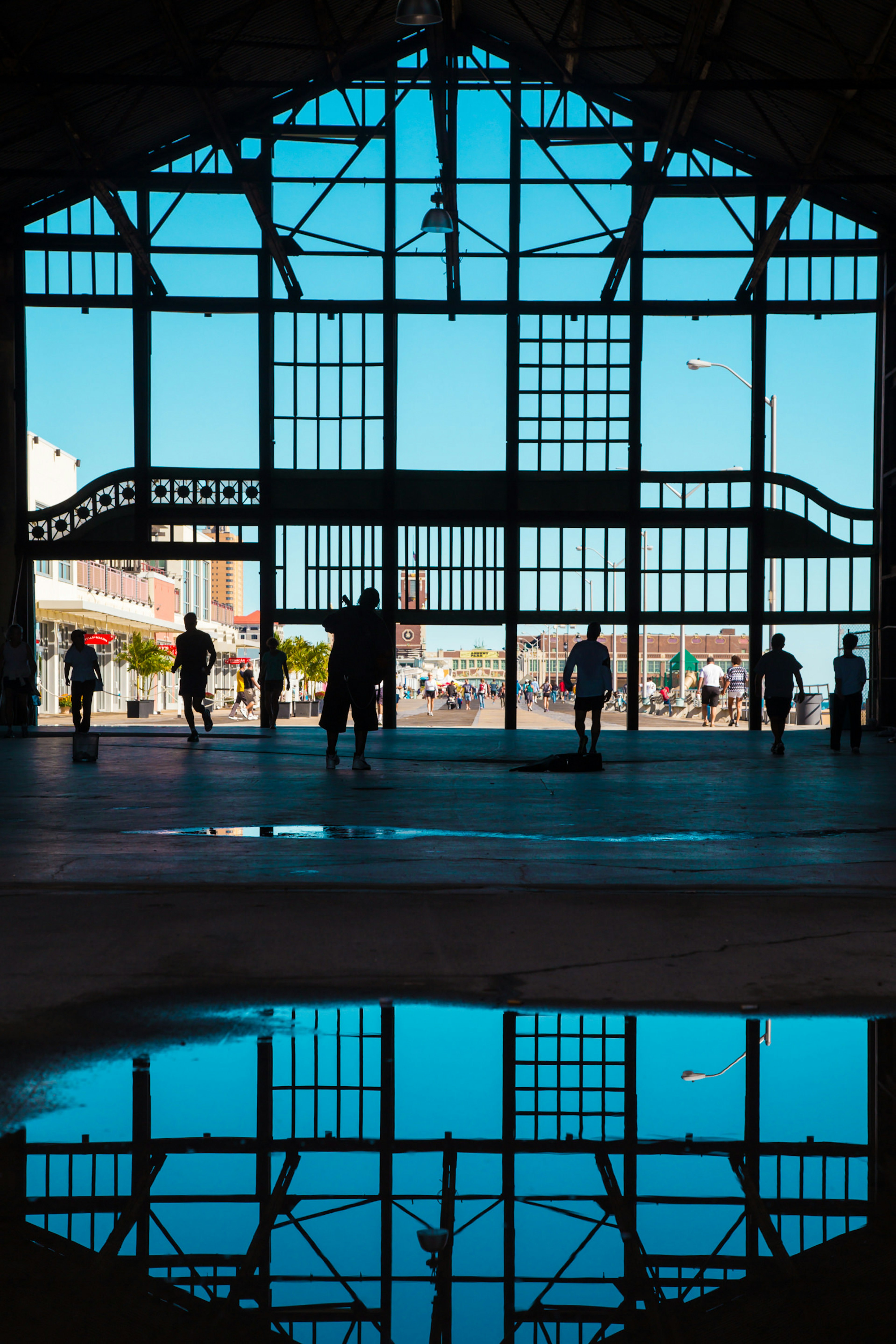 Shadows of window details form a silhouette against a blue sky