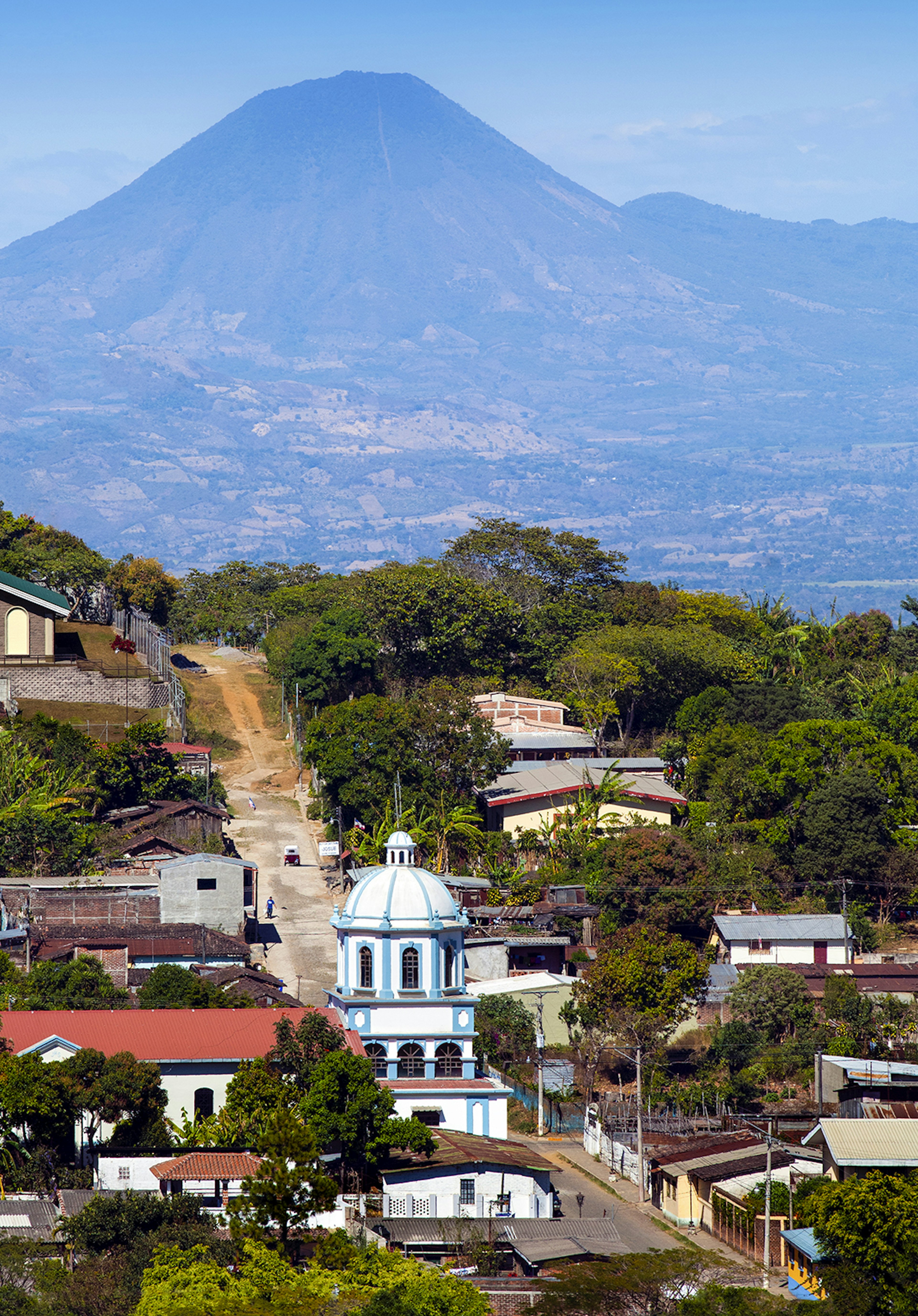 167875810
Volcano, Church, Christianity, Building Exterior, Architecture
El Chingo Volcano rises above the tourist town of Ataco, El Salvador and its church in the western part of the country.  El Chingo is an active volcano that sits on the border between El Salvador and Guatemala.