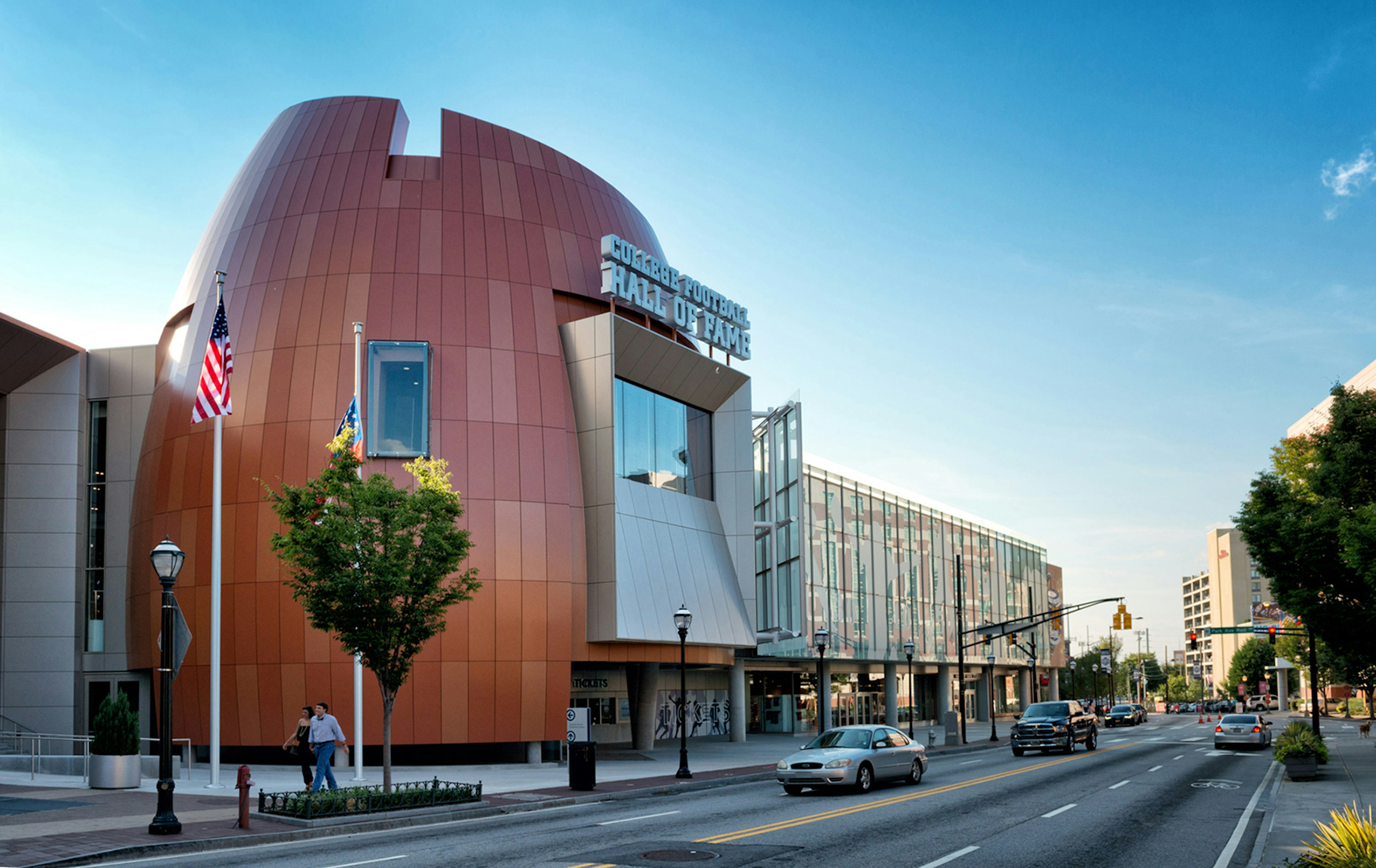 Facade of the modern-looking college football hall of fame in Atlanta Georgia, on a sunny day