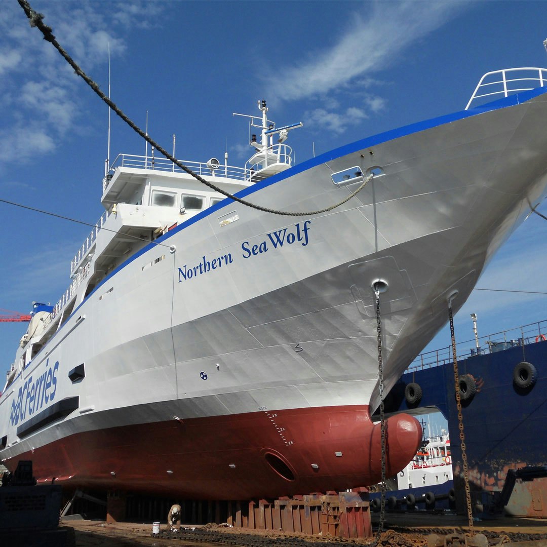 A large ferry is docked in a slip in British Columbia