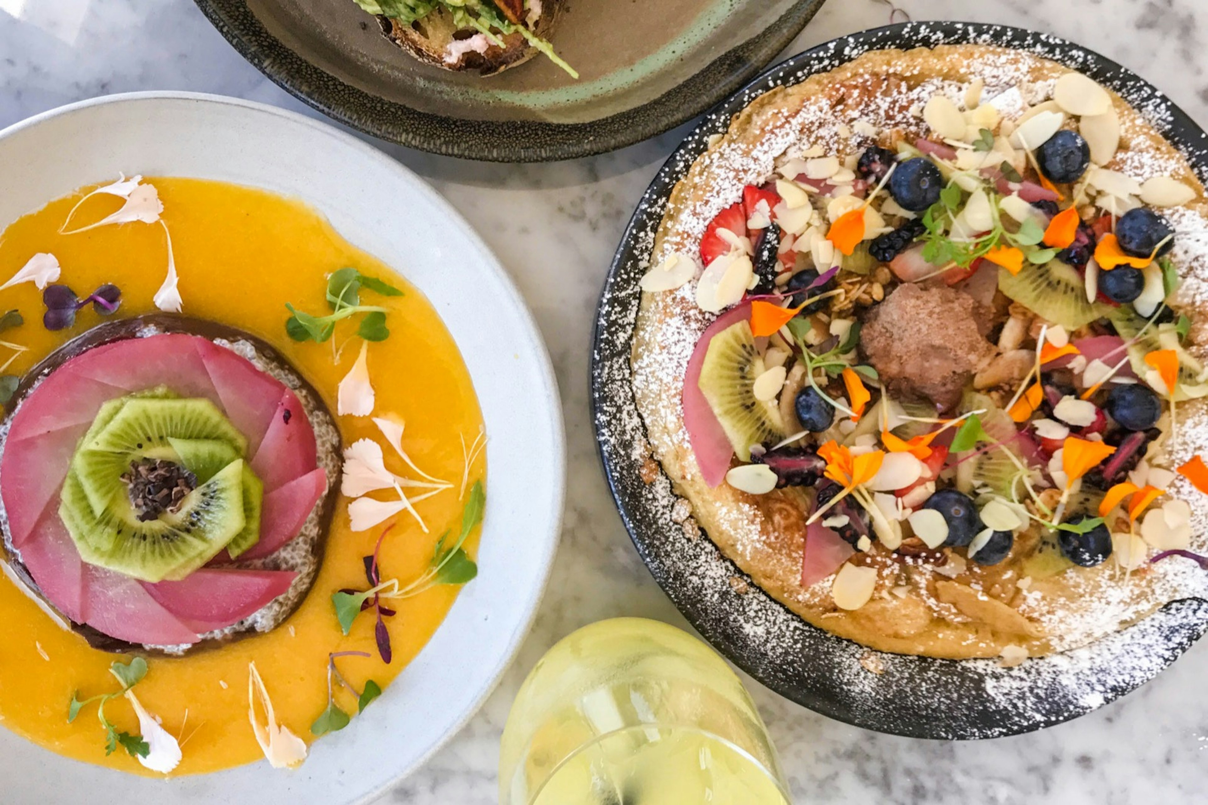 Looking down on a table covered in different brunch foods in Toronto