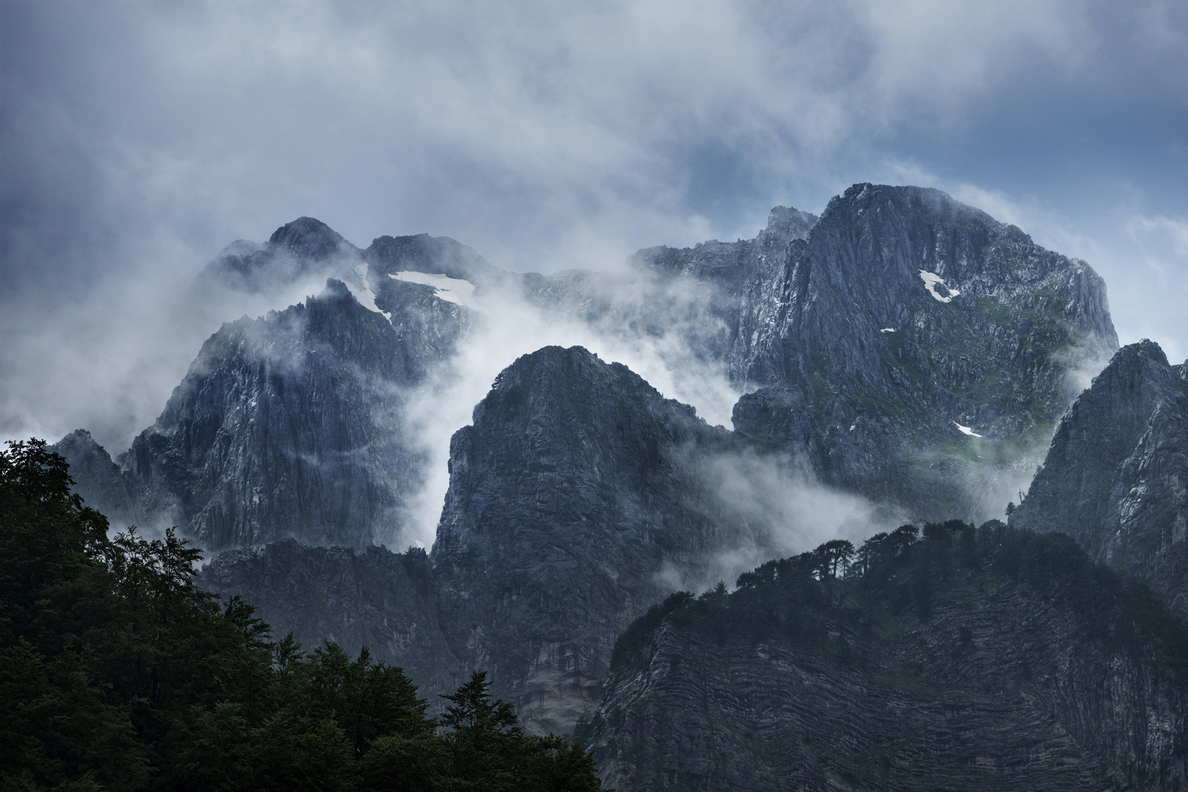 Thin cloud and patches of snow on the heights of the Accursed Mountains