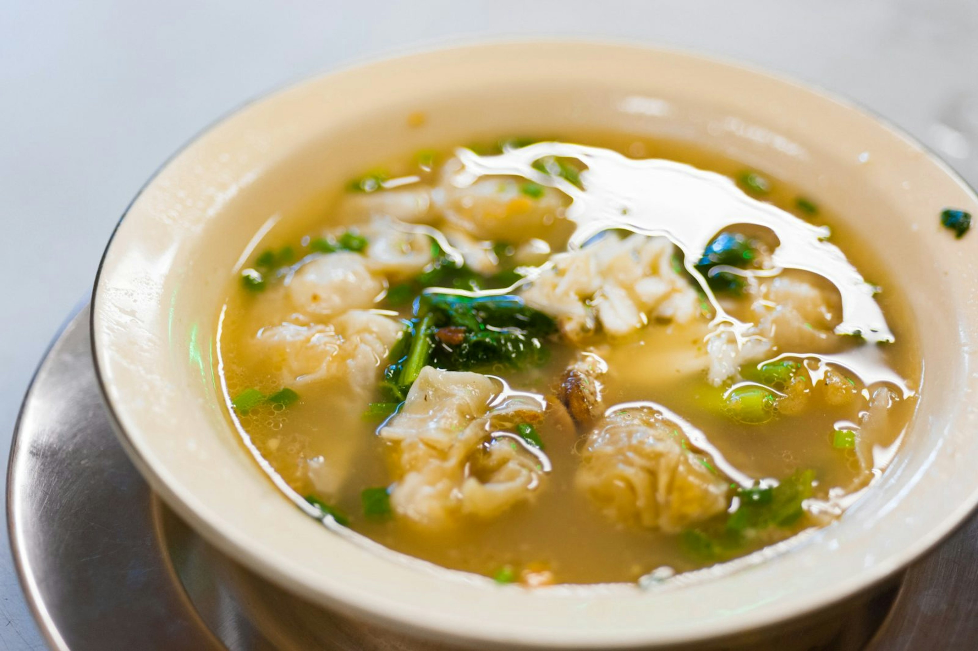 A bowl of Chinese-style noodles, served here with wantons, Bangkok © Austin Bush / Lonely Planet