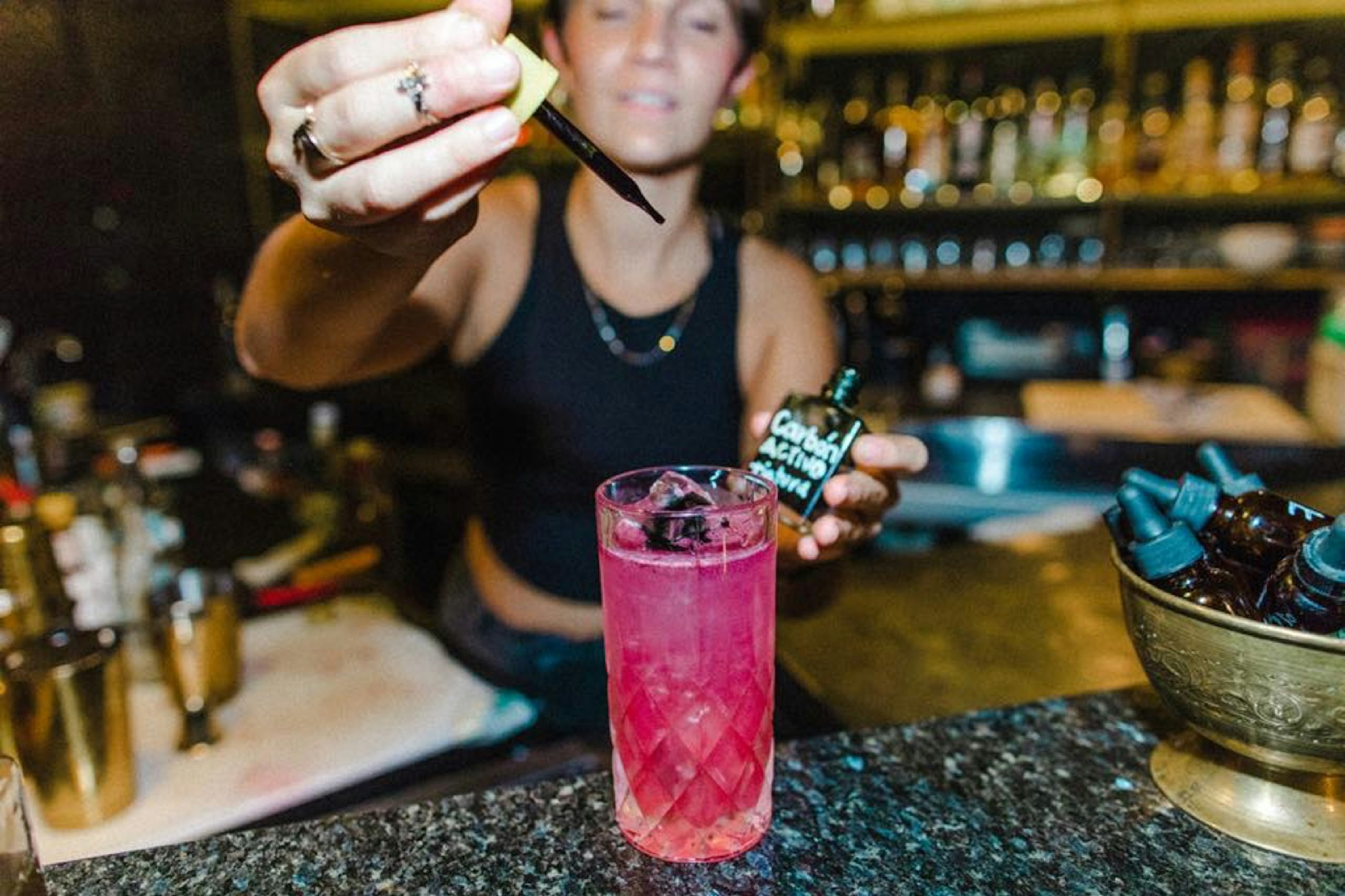 A bartender adds a few drops of active carbon to a drink at El Bebedoro in San Jose, Costa Rica. The restaurant scene is thriving in the country's capital city.