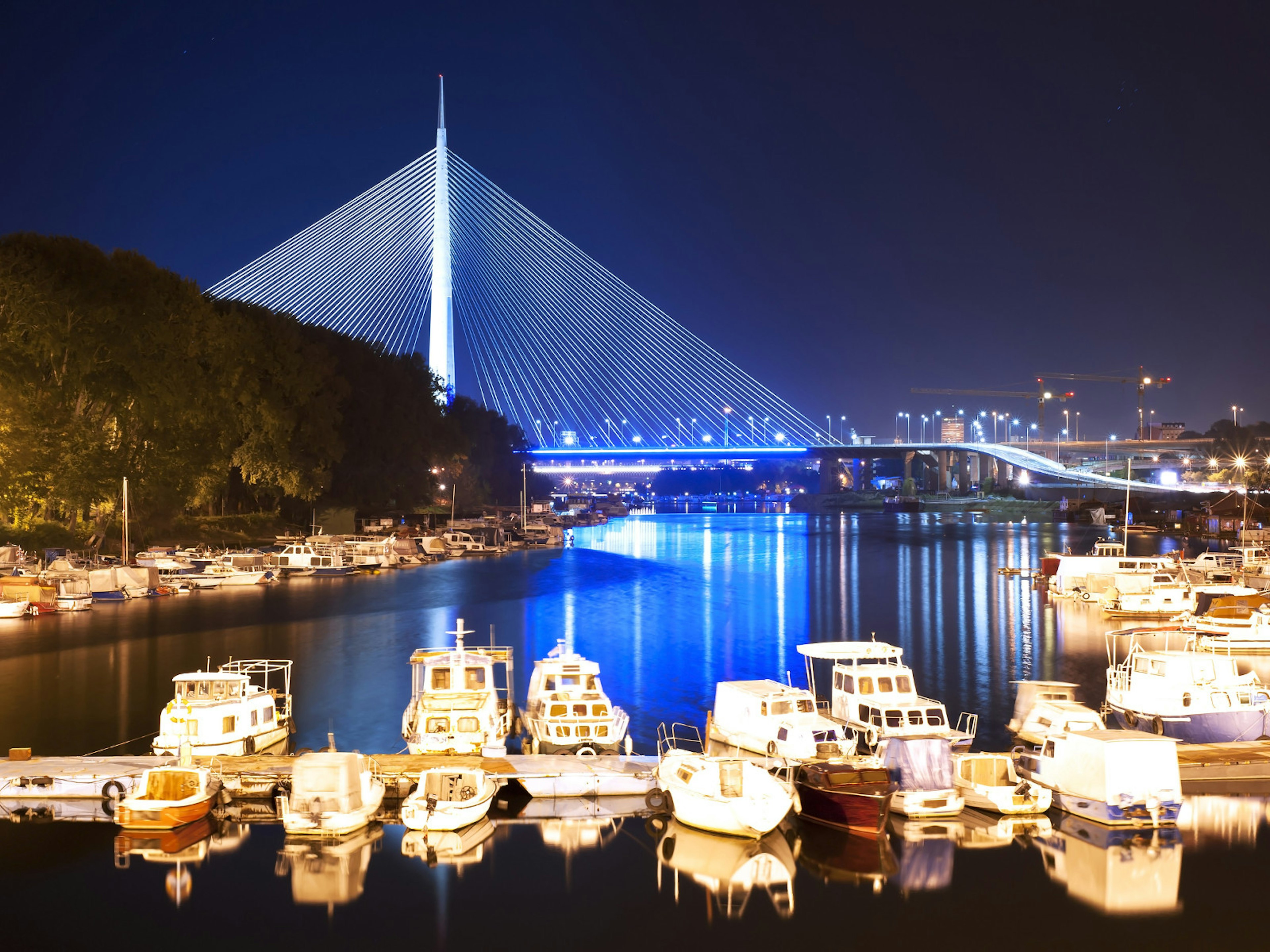 Marina and new Ada bridge at Ada Ciganlija island on the Sava River © Bojan Bokic / Shutterstock