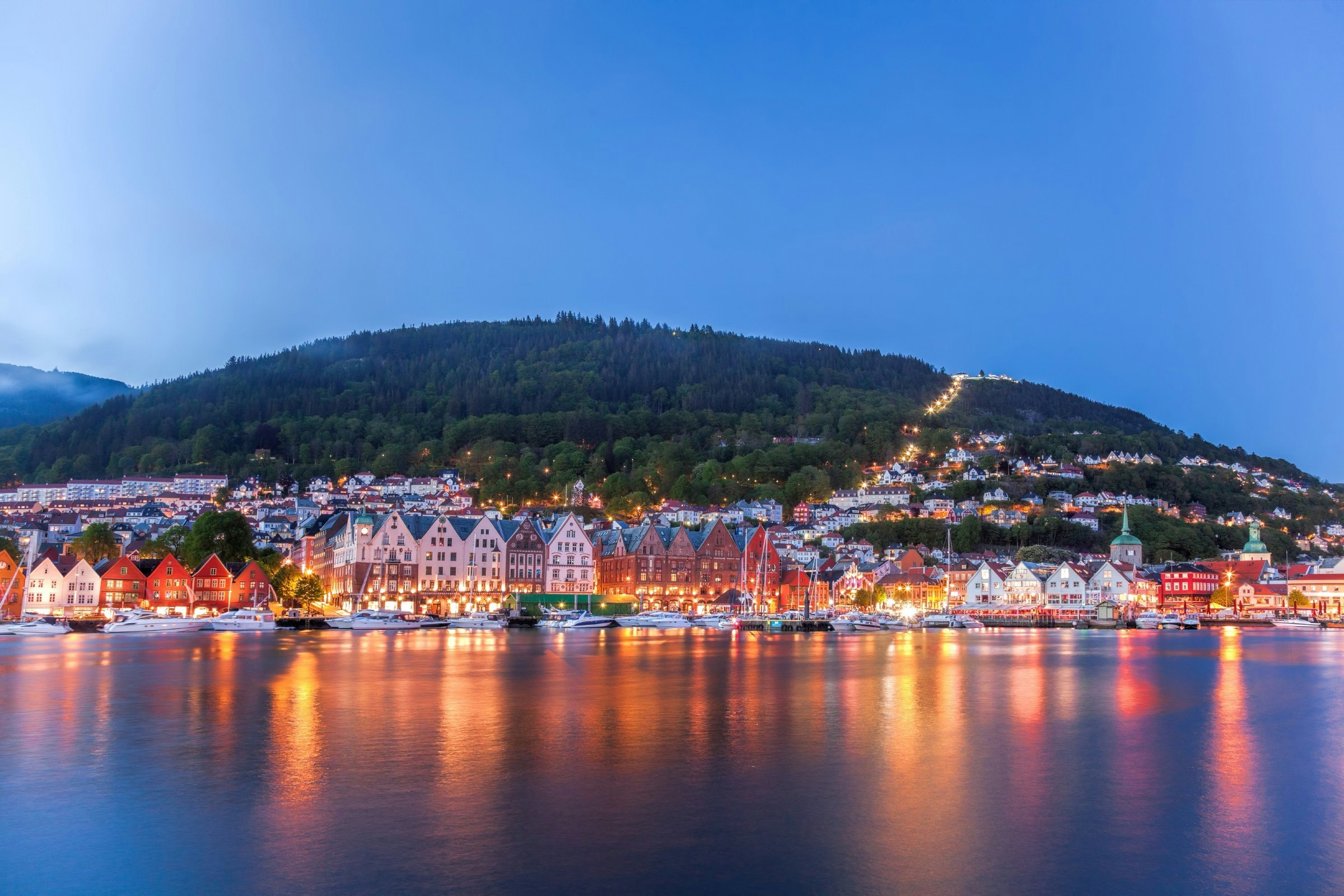 Bergen street at night with boats in Norway