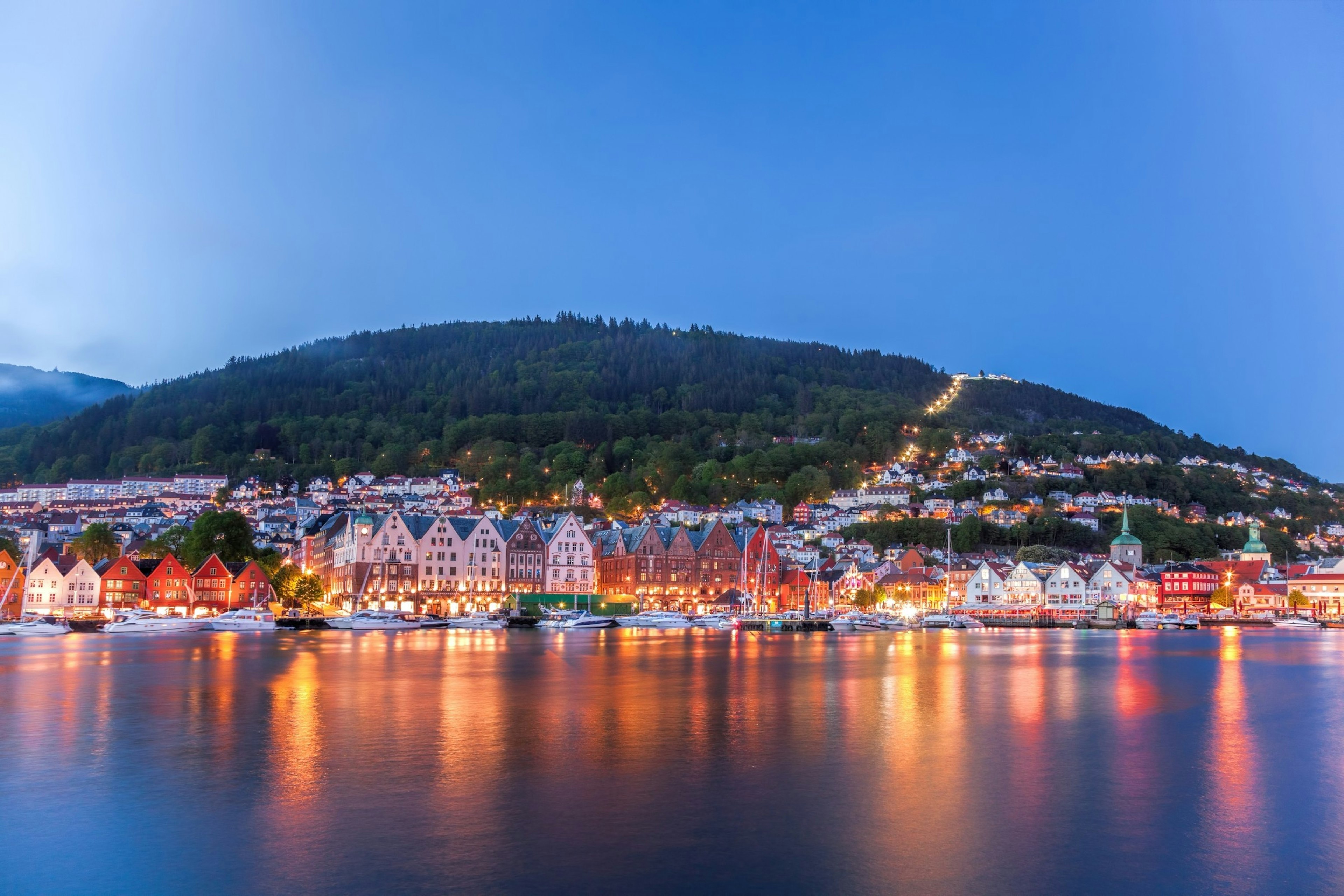 Bergen street at night with boats in Norway