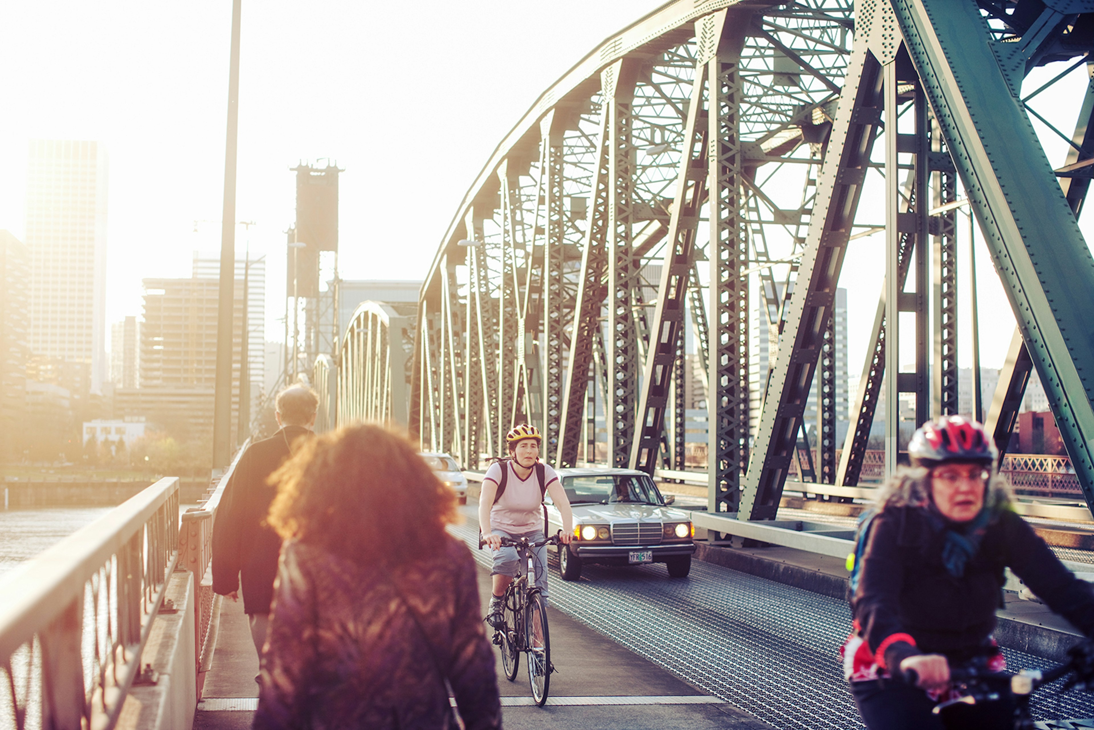 Cyclists cross Hawthorne Bridge in Portland, Oregon