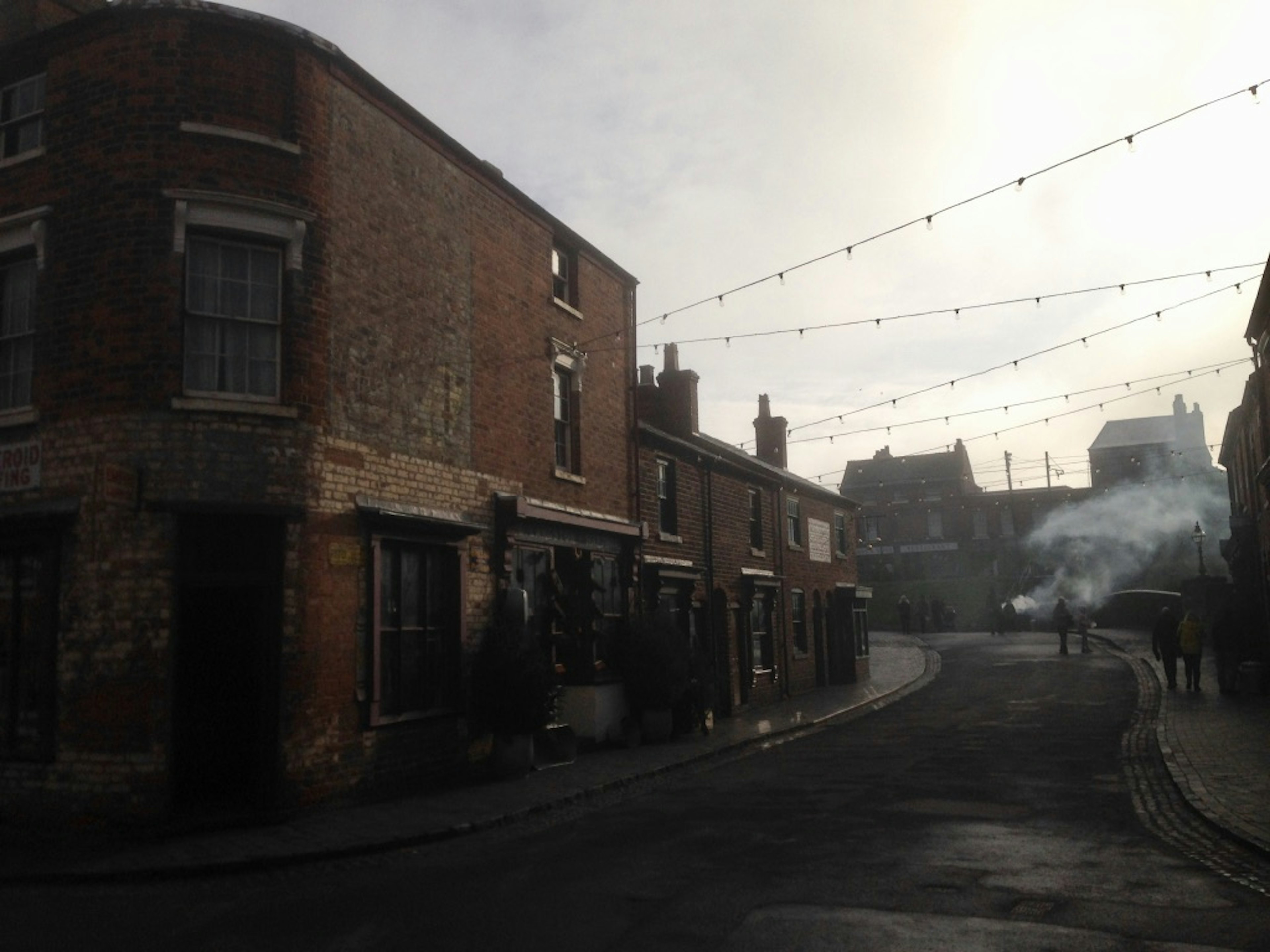 A dark street in Birmingham at dusk