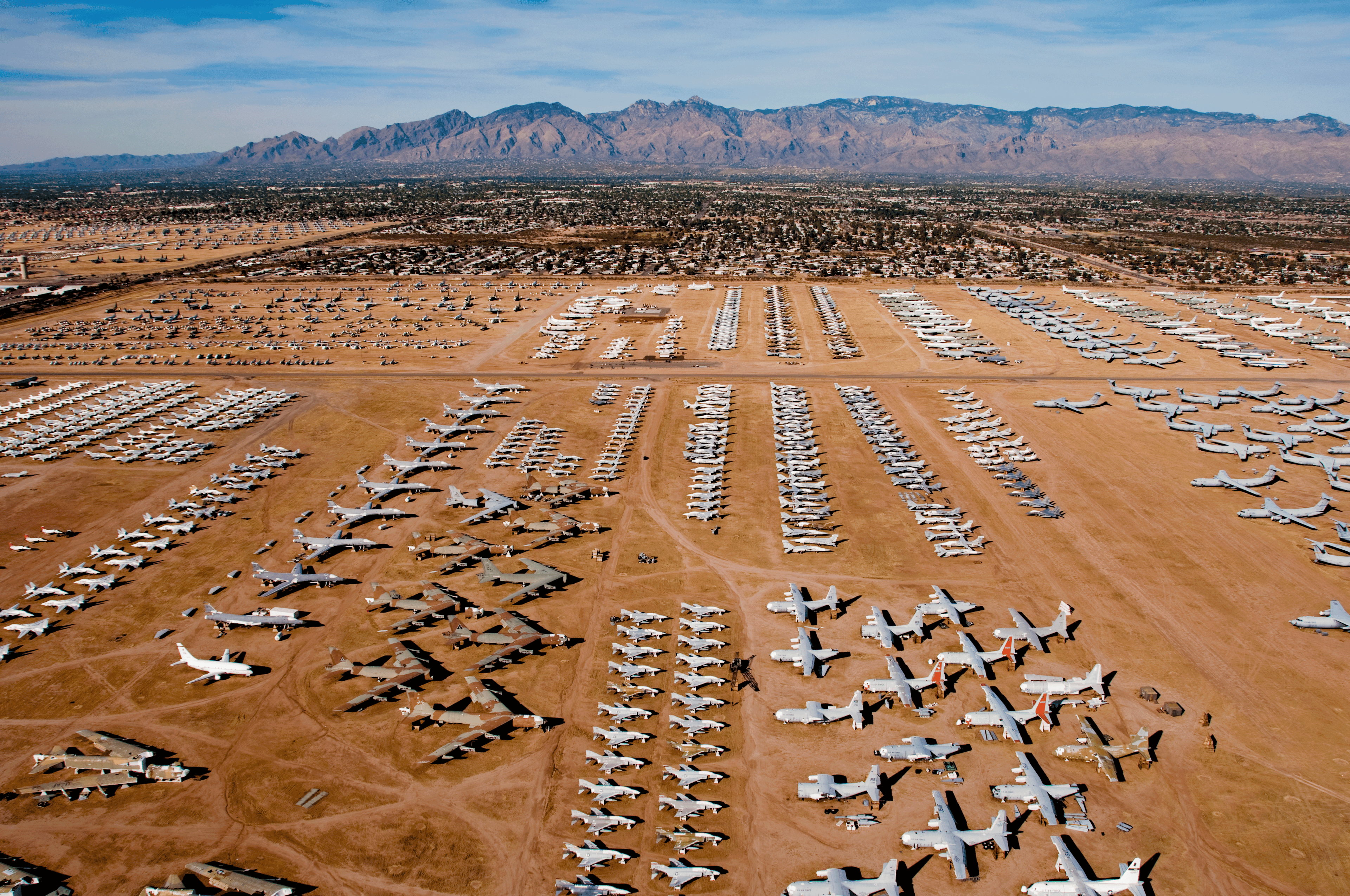 Planes are placed in formation in the desert in front of mountains © Steve Proehl / Getty Images