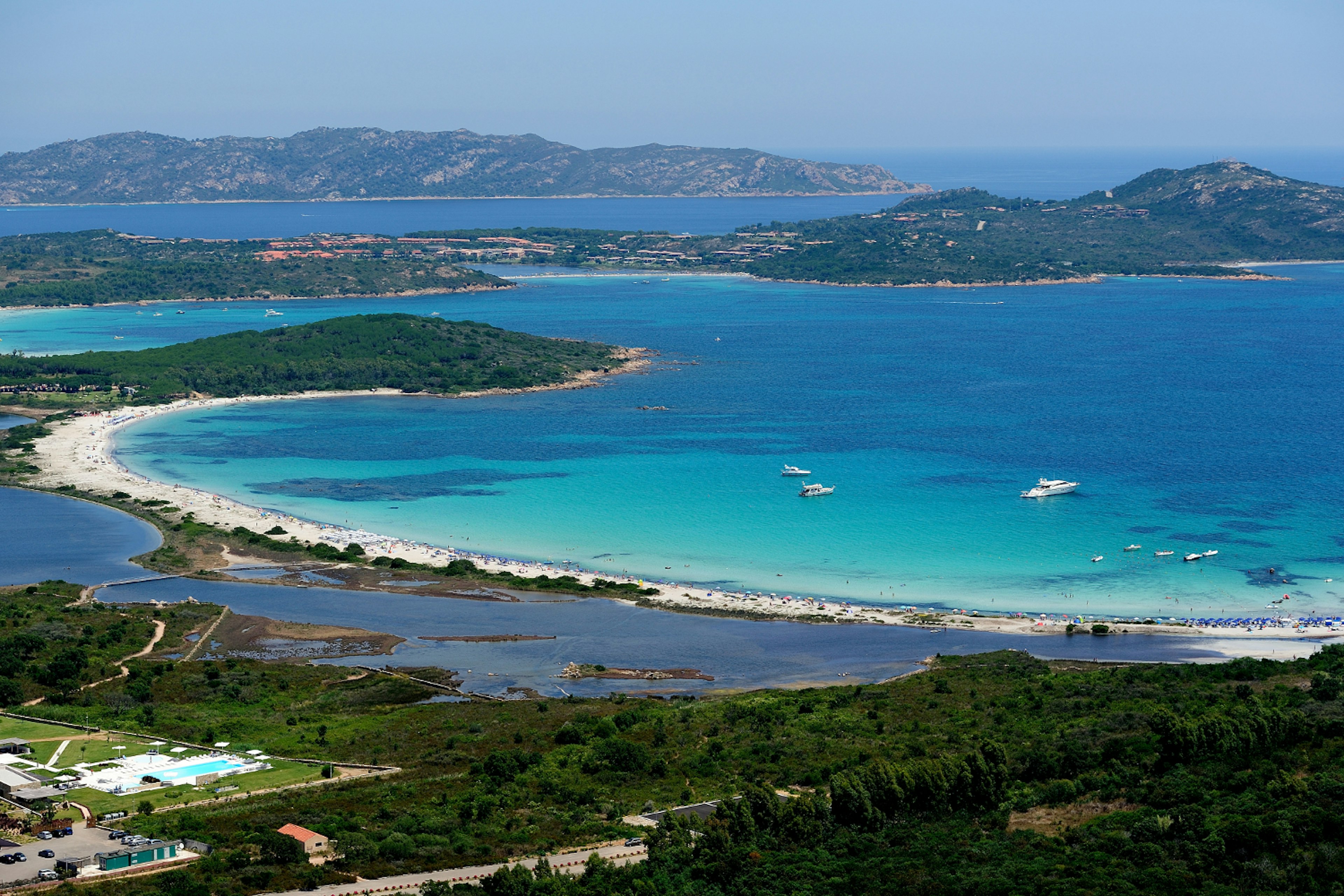 Landscape view of the expansive blue waters of Cala Brandinchi, Sardinia.