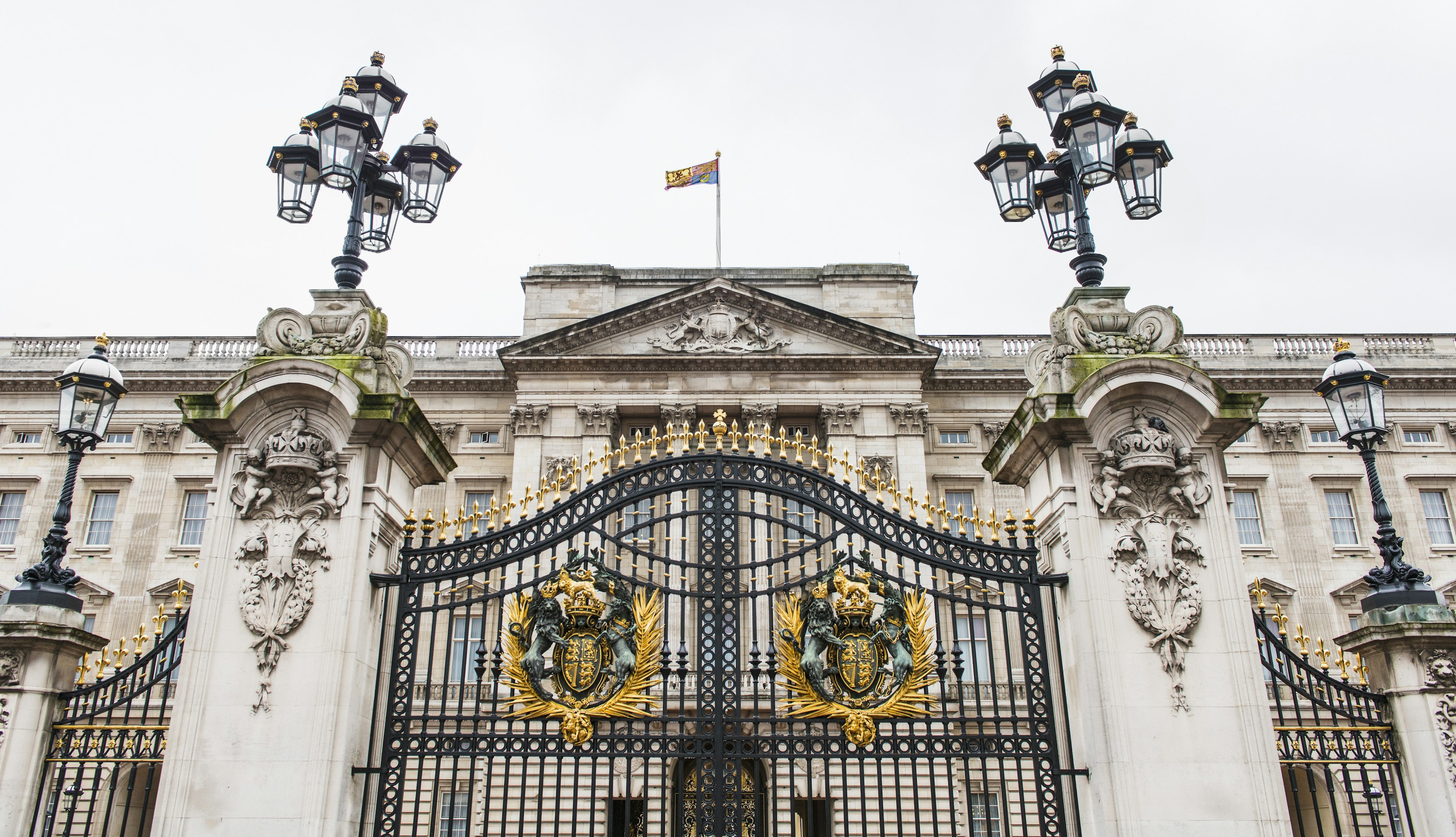 The closed black gates of Buckingham Palace in London, England