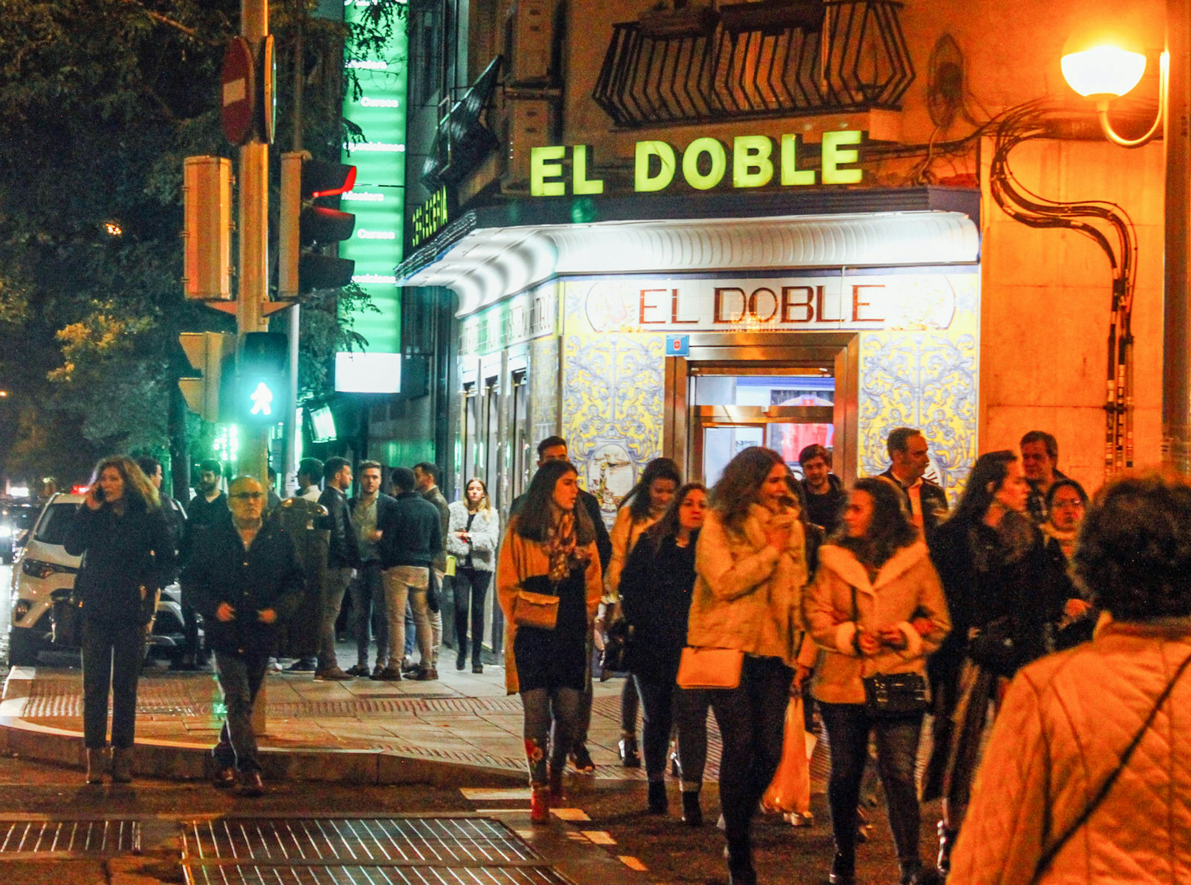 Crowds gather along Calle Ponzano on a Saturday evening