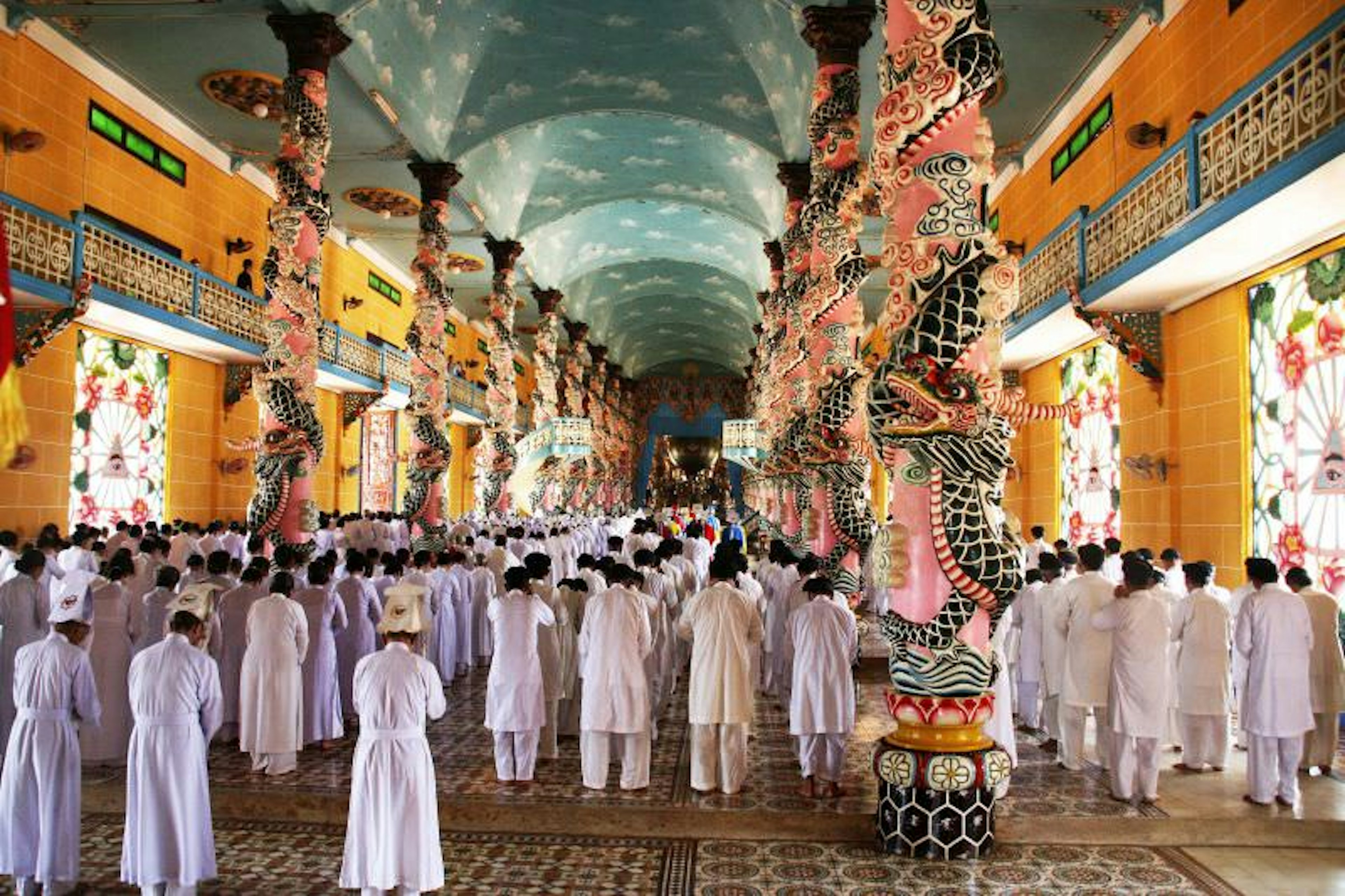 People in prayer at Cao Dai Temple, Ho Chi Minh City