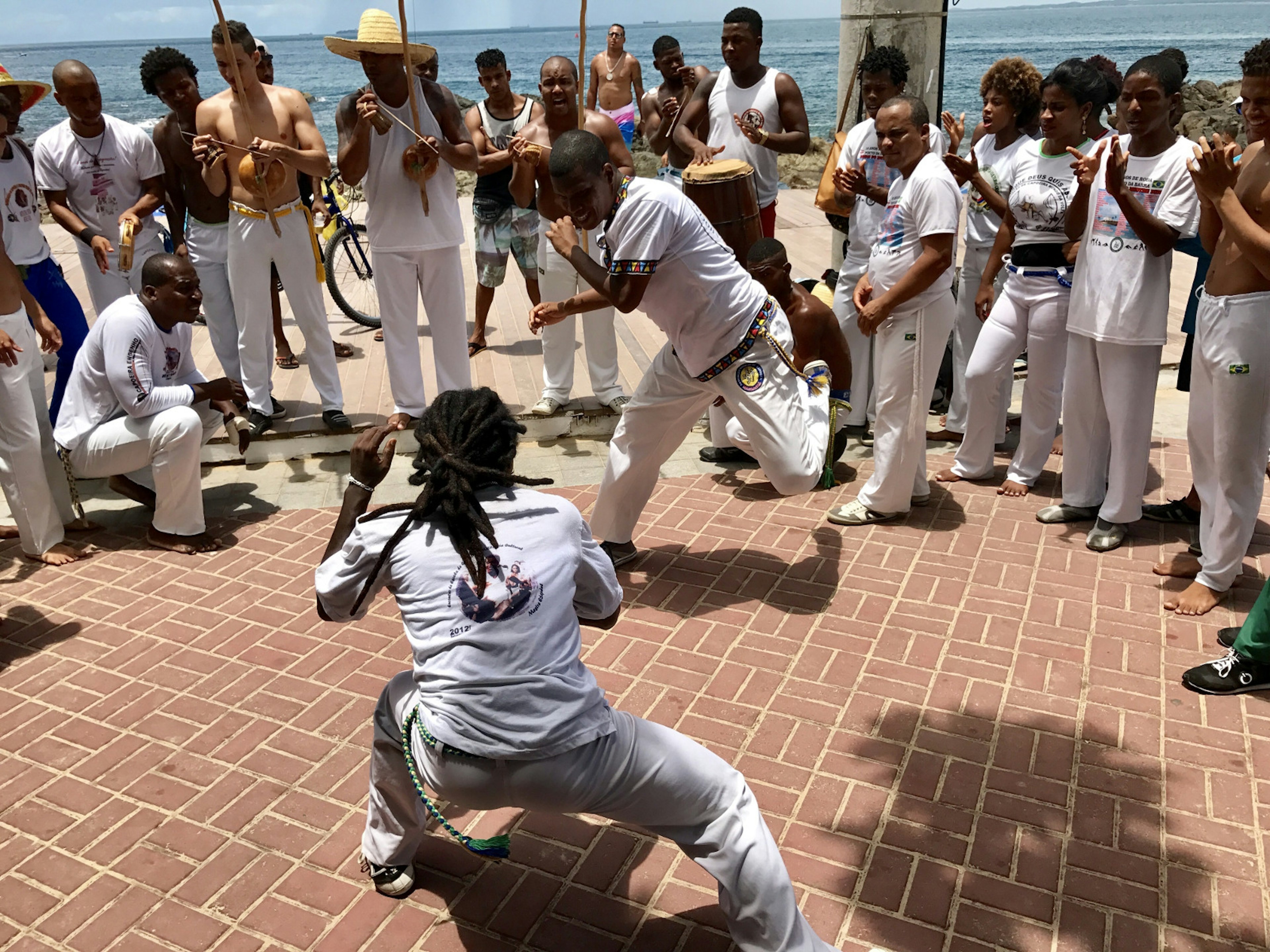 Capoeira performers entertain a crowd on the streets of Salvador, Brazil