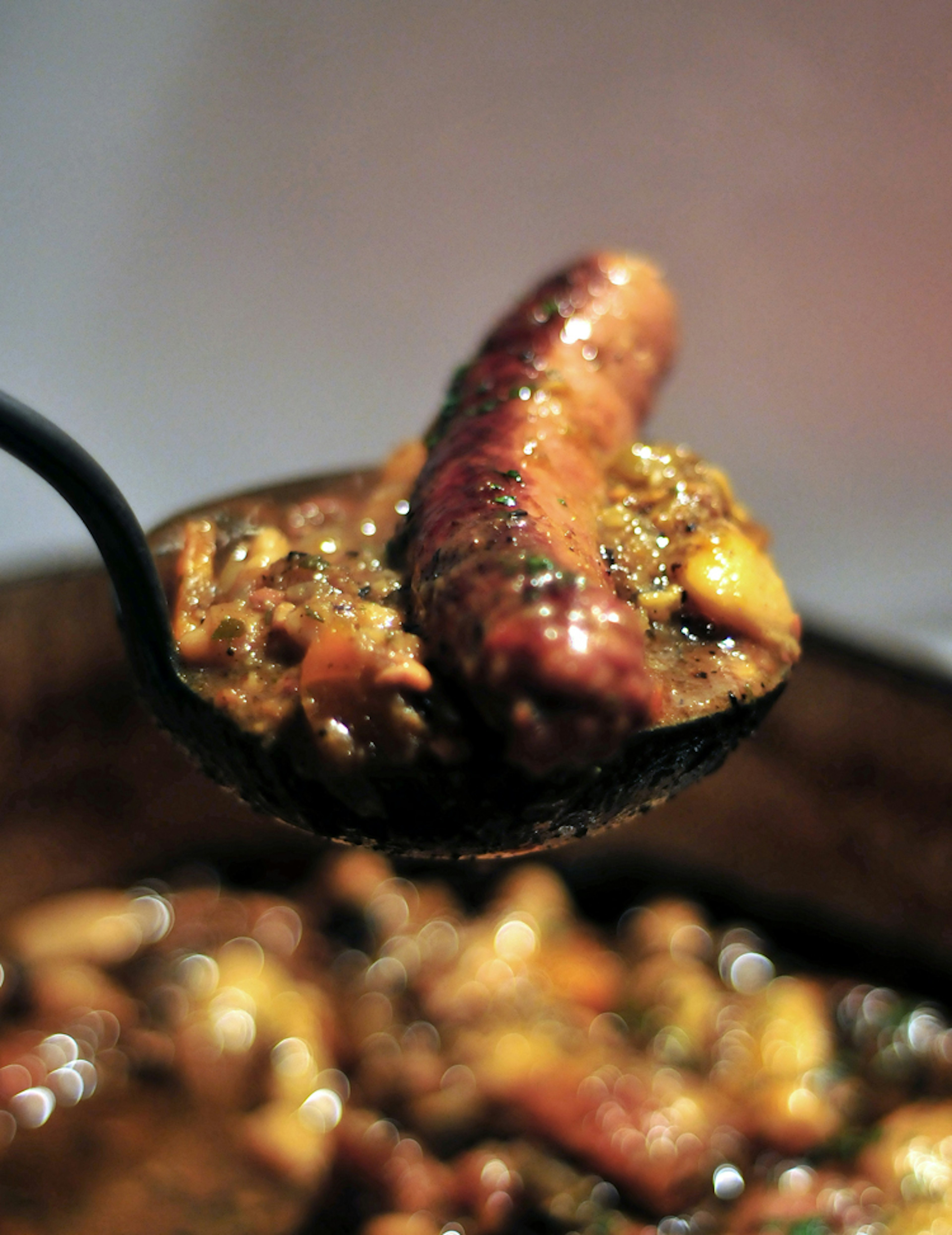 A hearty mouthful of cassoulet with Toulouse sausage. Image by tristangeorge / Moment / Getty Images.