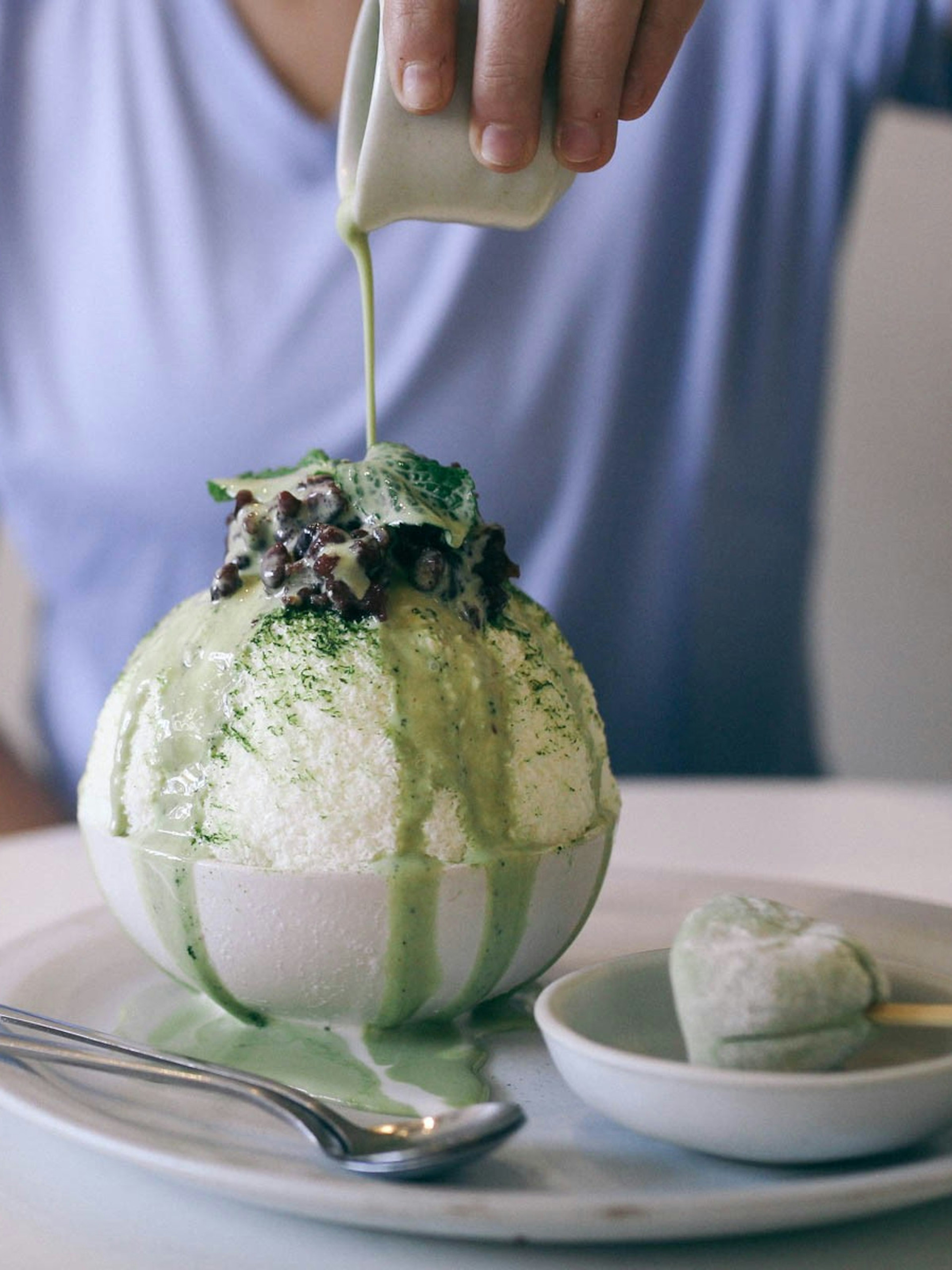 A bowl of bingsu (milky shaved ice topped with sweet treats) at Cheevit Cheeva cafe