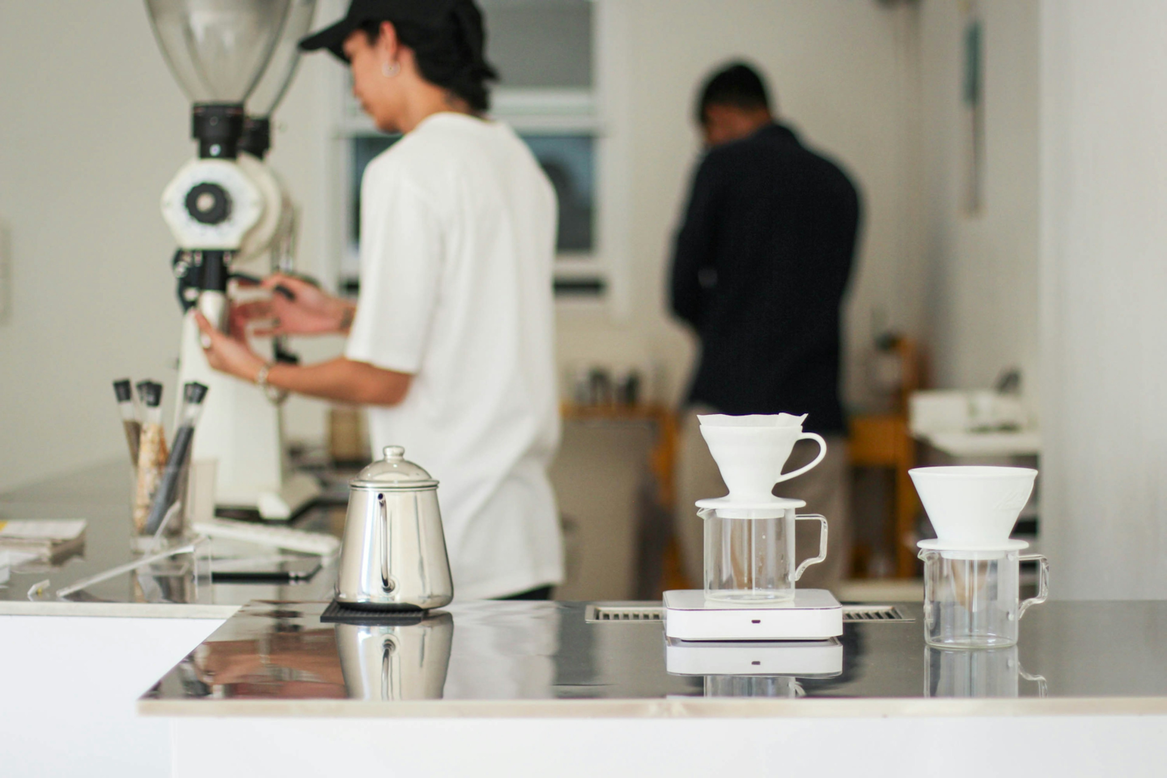 Baristas work to prepare coffee in a Chiang Mai cafe