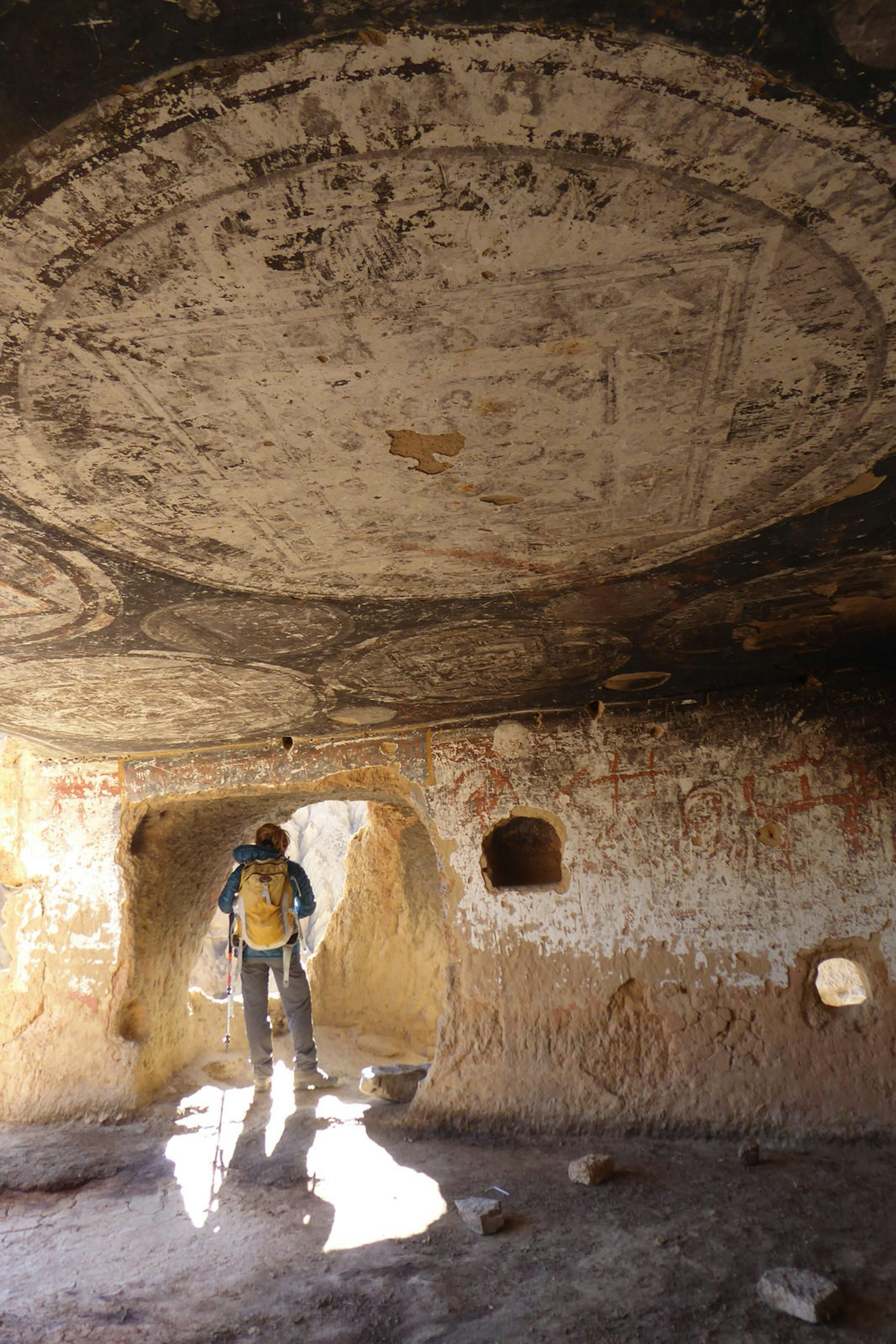 Faded mandalas on the roof of a cave in Mustang