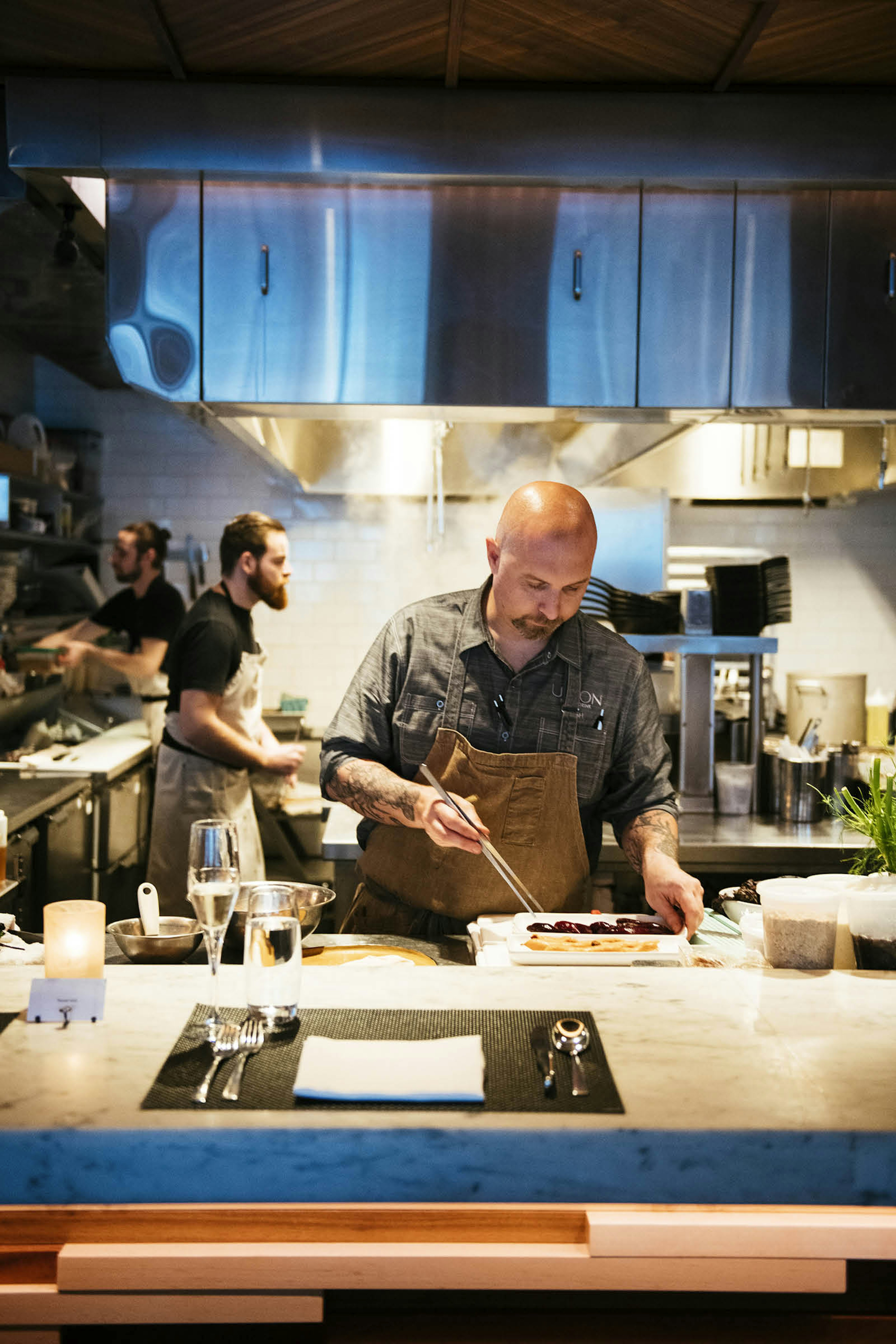 Chef Josh Berry plating up in the kitchen of Union restaurant