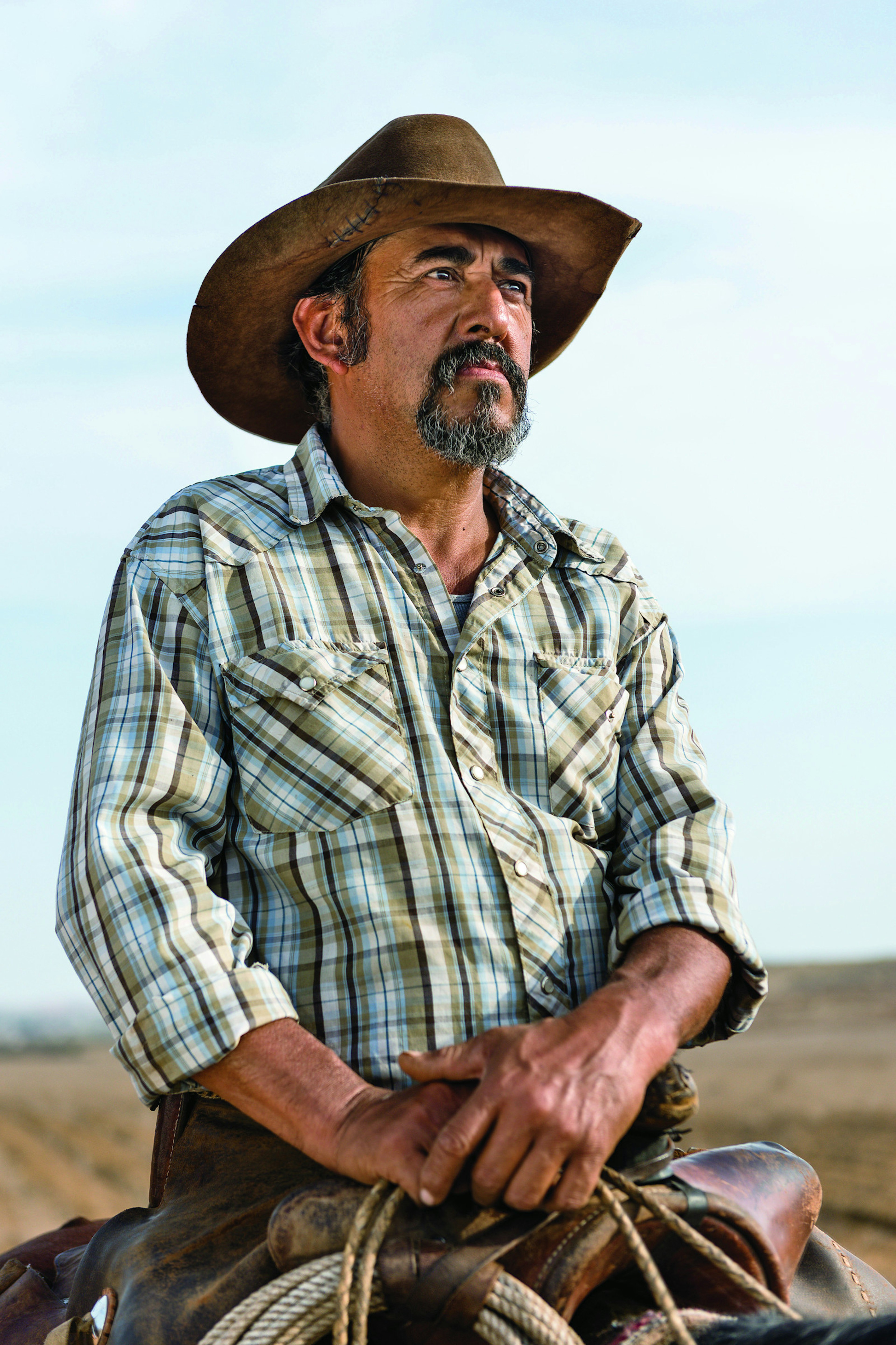 Cowboy Marcial Ruben Arce Villavicencio sitting astride his horse