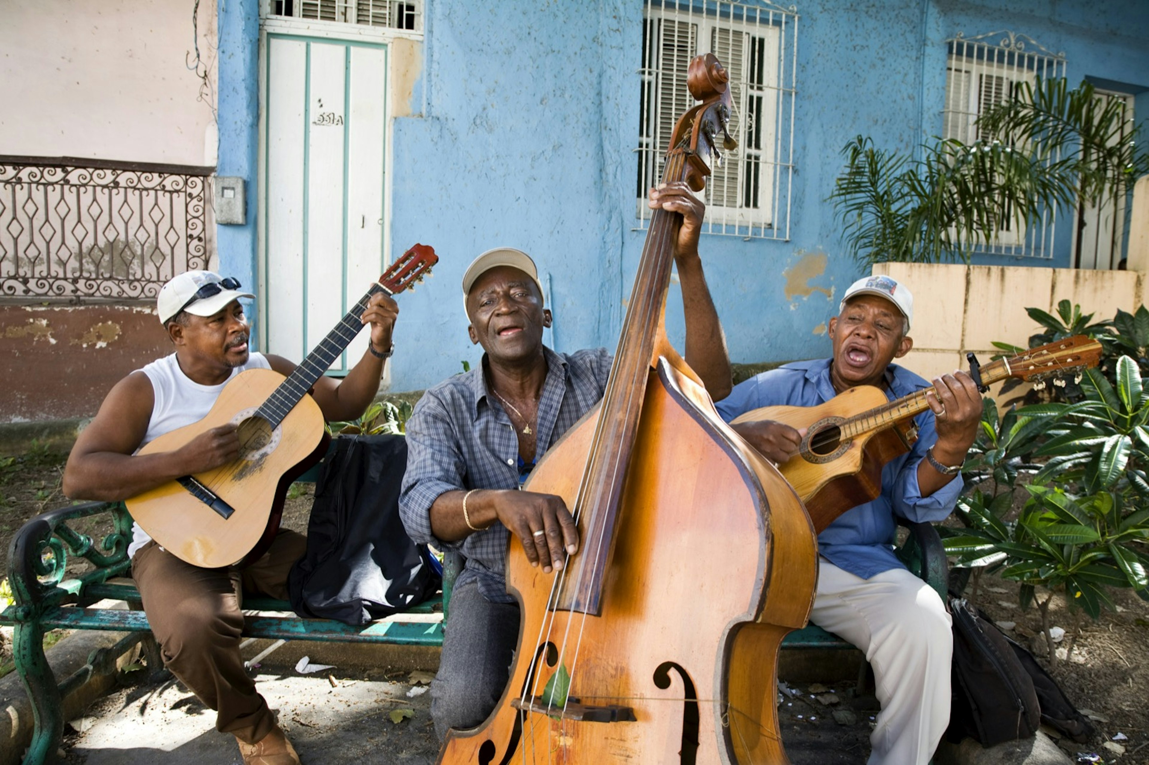 A trio of street musicians perform outdoors in Santiago de Cuba. A new Trump administration policy will have a huge impact on the Cuban economy and its people.