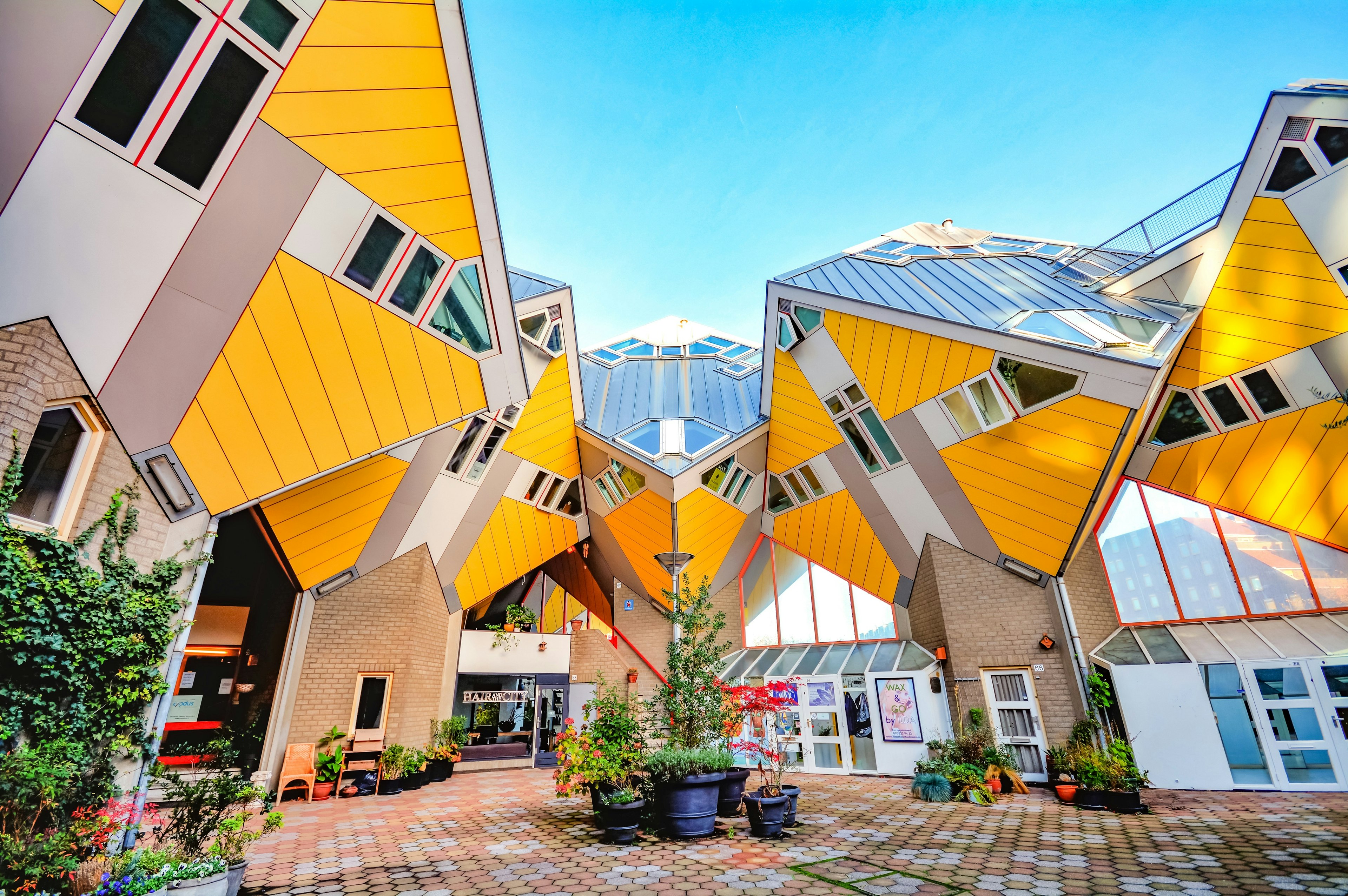 Rotterdam's Cube Houses, yellow and white homes that resemble cubes tiled at 45 degrees above the ground.