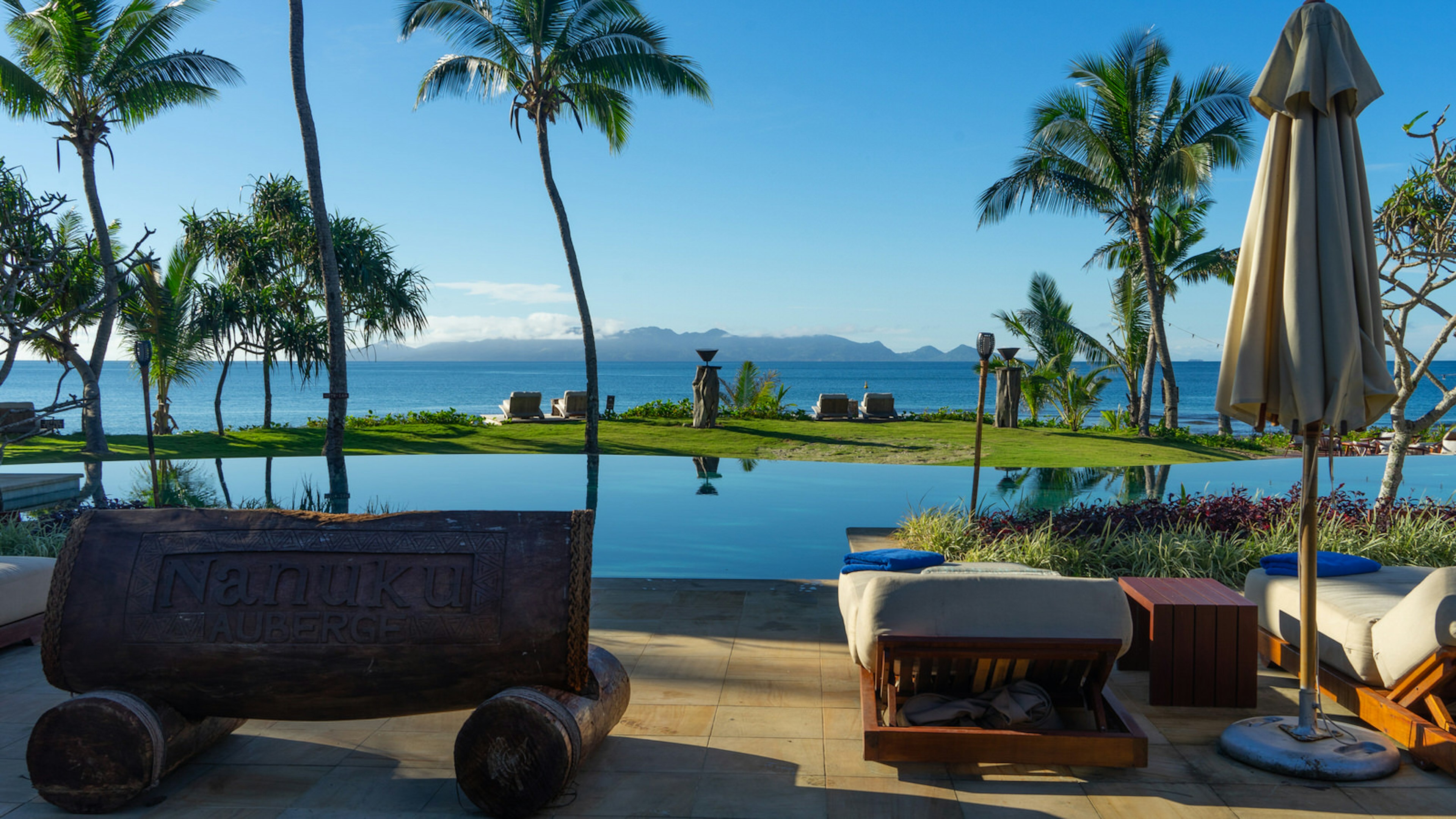 An idyllic coastal resort in Auberge. An infinity pool looks out over endless blue sky and sea.