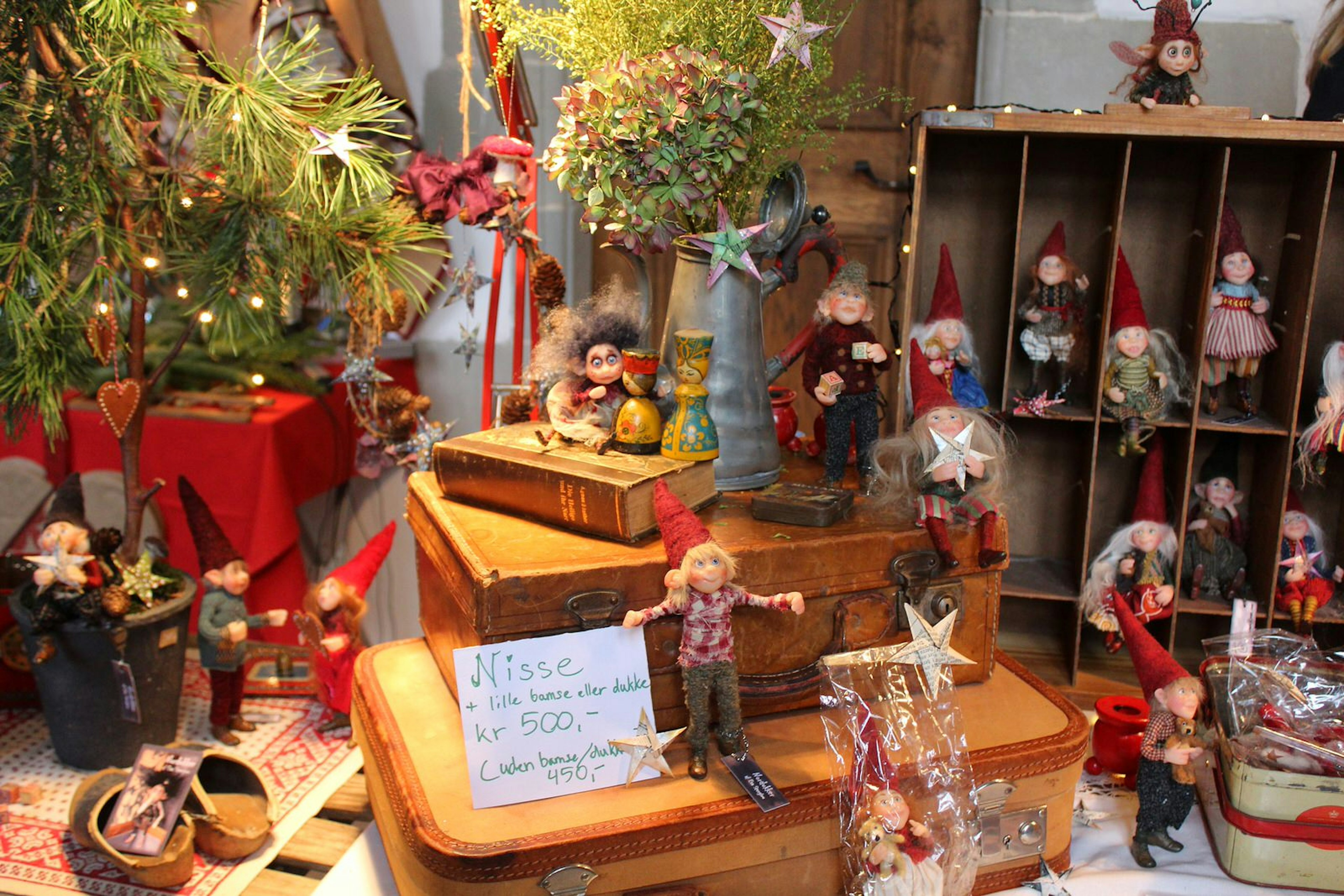 A display of handicrafts including wooden figures with woollen clothes for sale at a Christmas market in Copenhagen © Caroline Hadamitzky / Lonely Planet