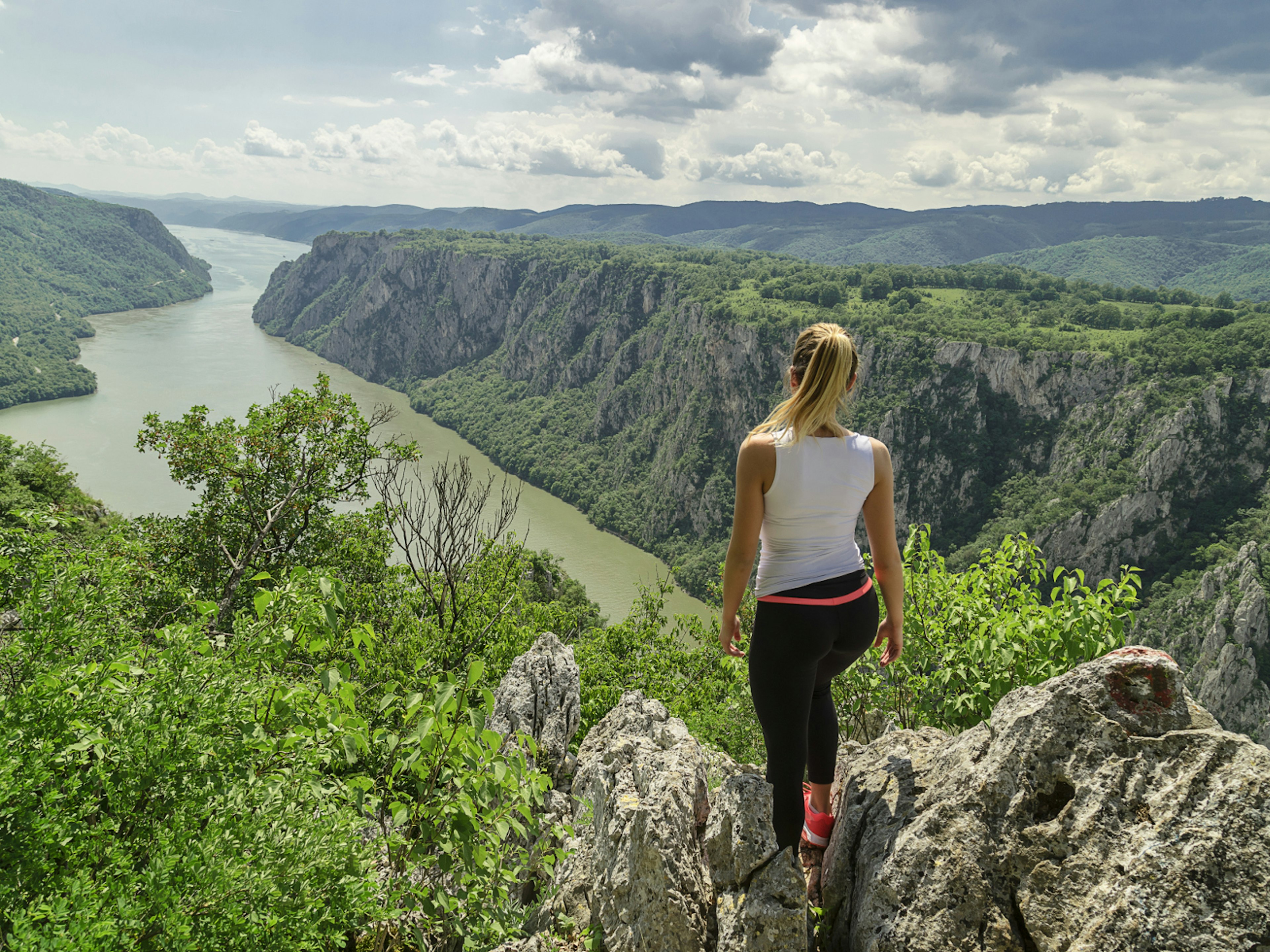 A hiker takes in the Danube views at the Iron Gates gorge in Djerdap National Park © Darko Manasic / Shutterstock