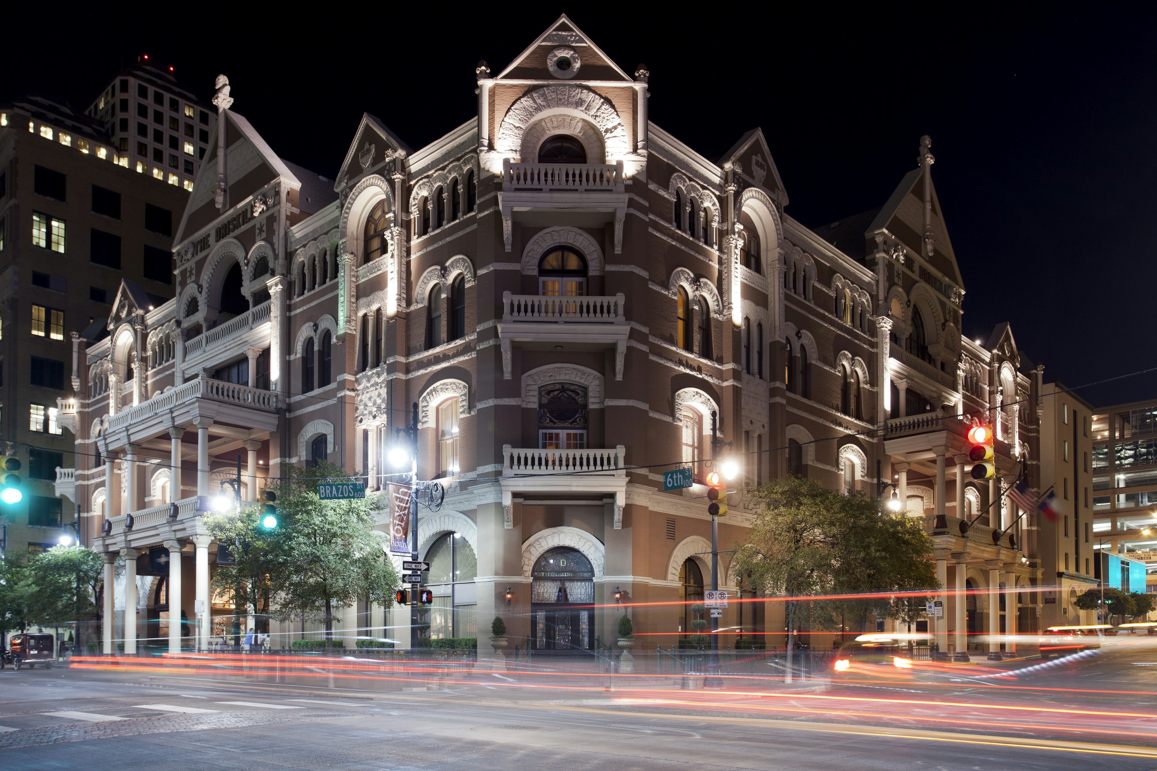 Outside shot of the Driskill hotel at night; Norman vs. Austin