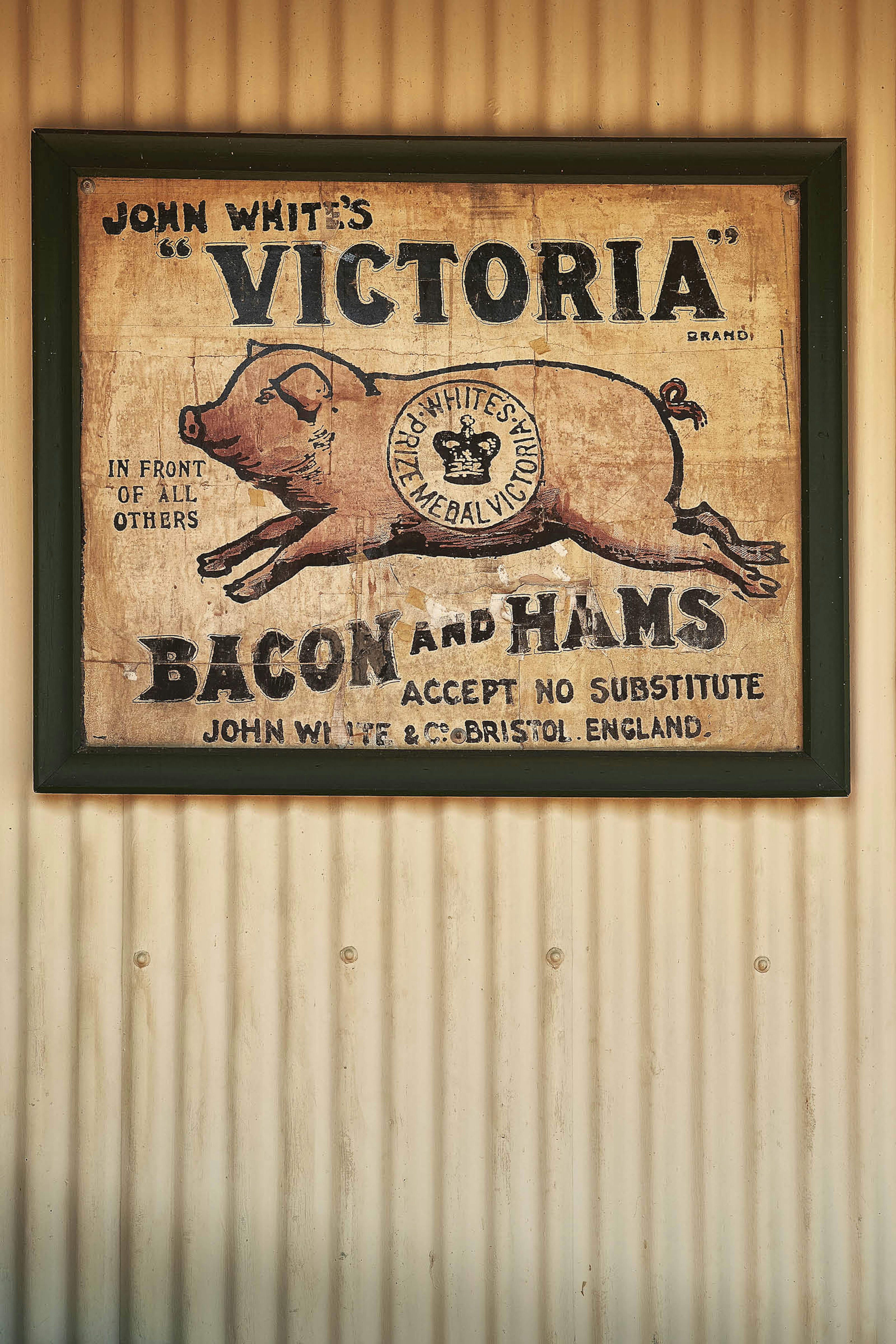 A vintage sign for bacon and ham at The Vine, a pub in Pilgrim’s Rest