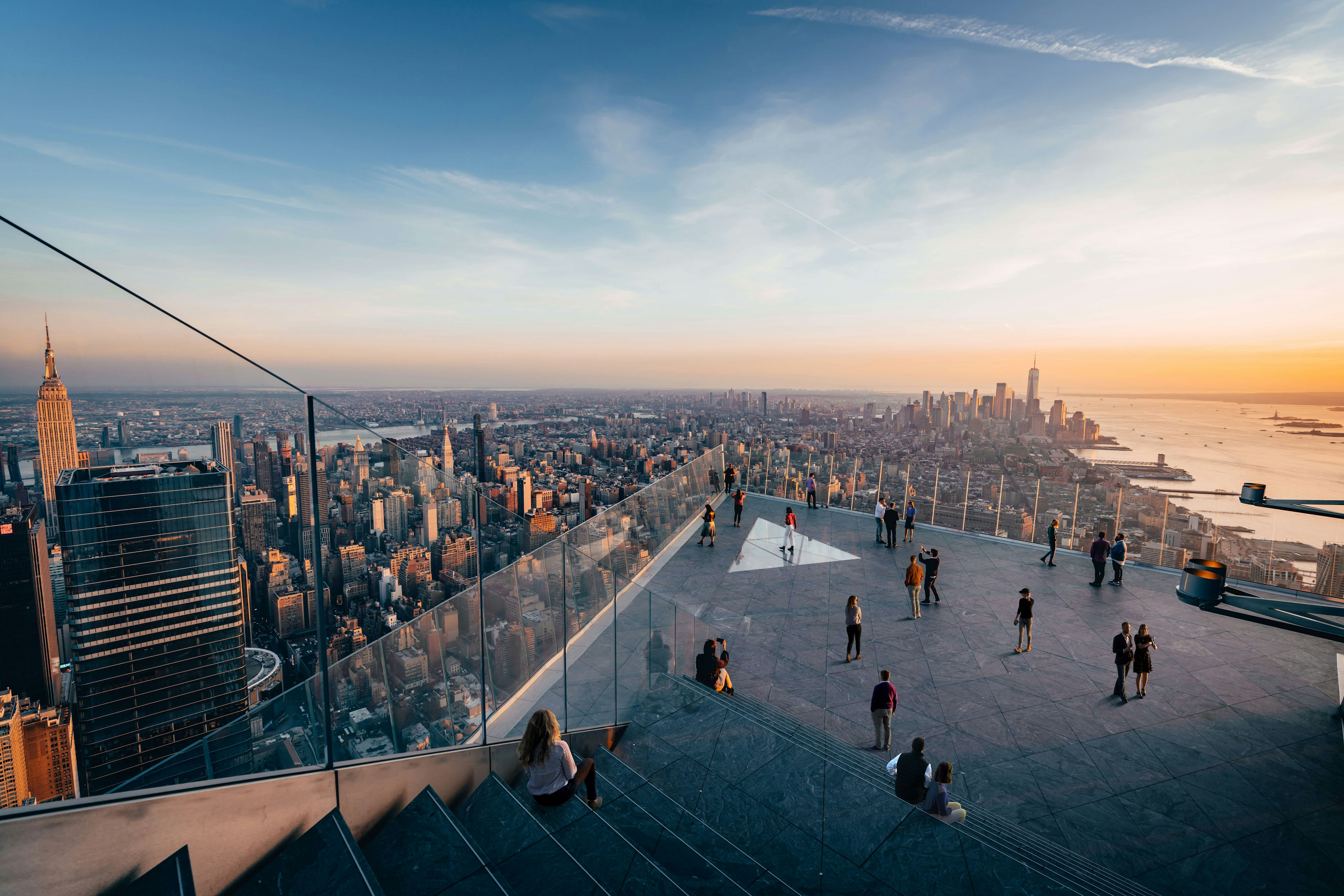 People walking along the outdoor sky deck at the Edge