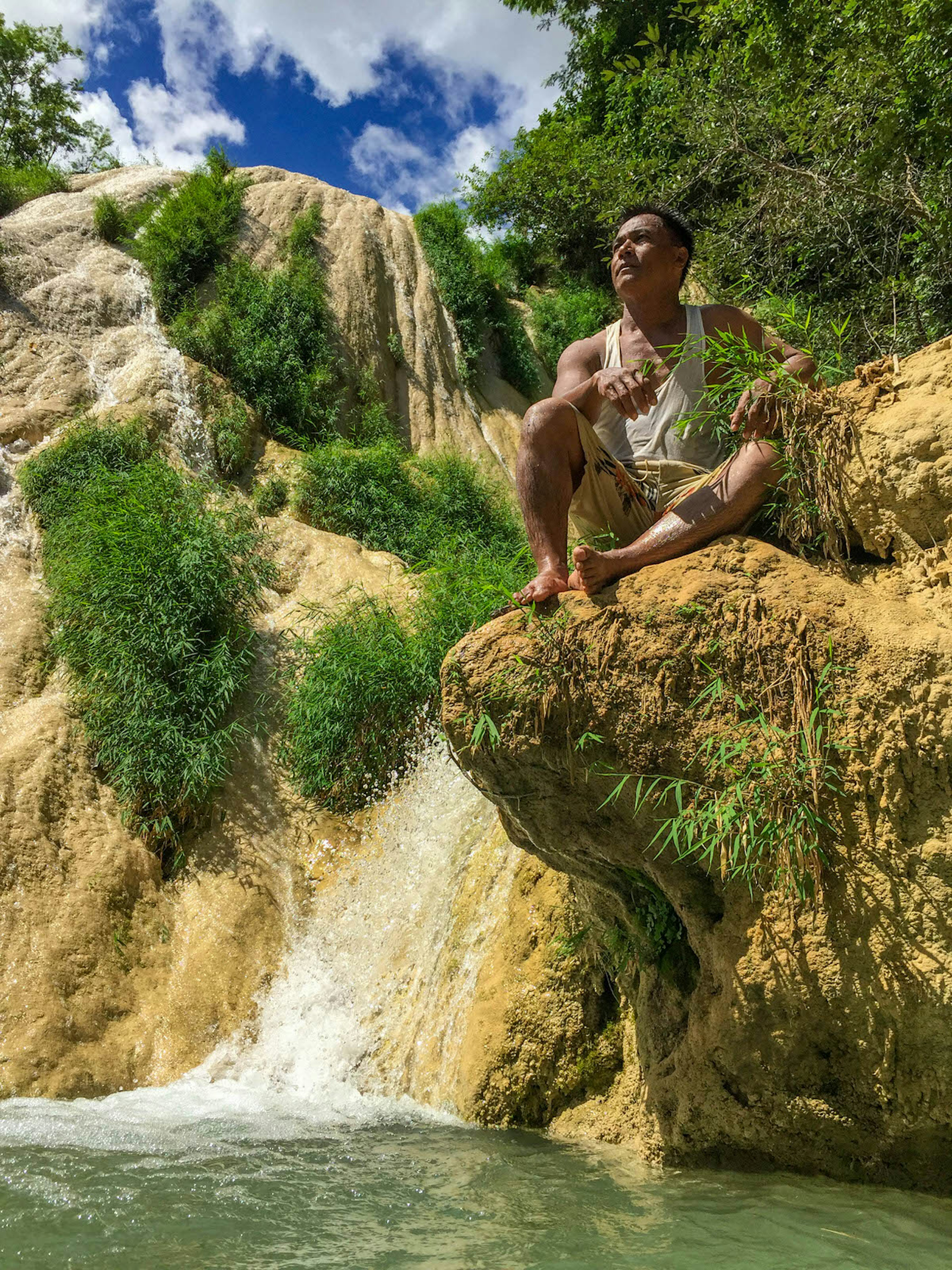 A man takes in the view at the Eight Floor waterfall