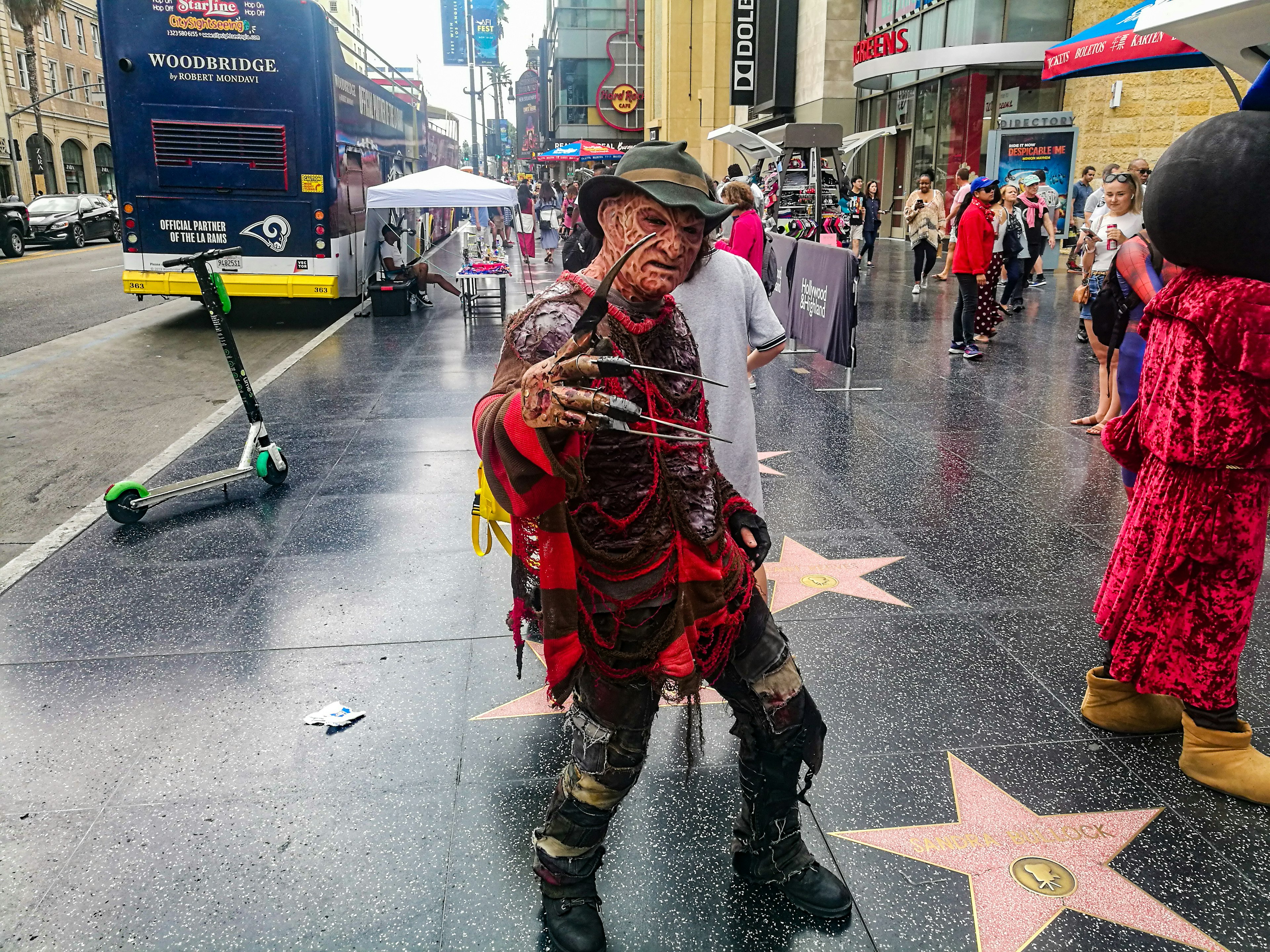 A Freddy Krueger impersonator standing on the Walk of Fame (next to the Sandra Bullock star)