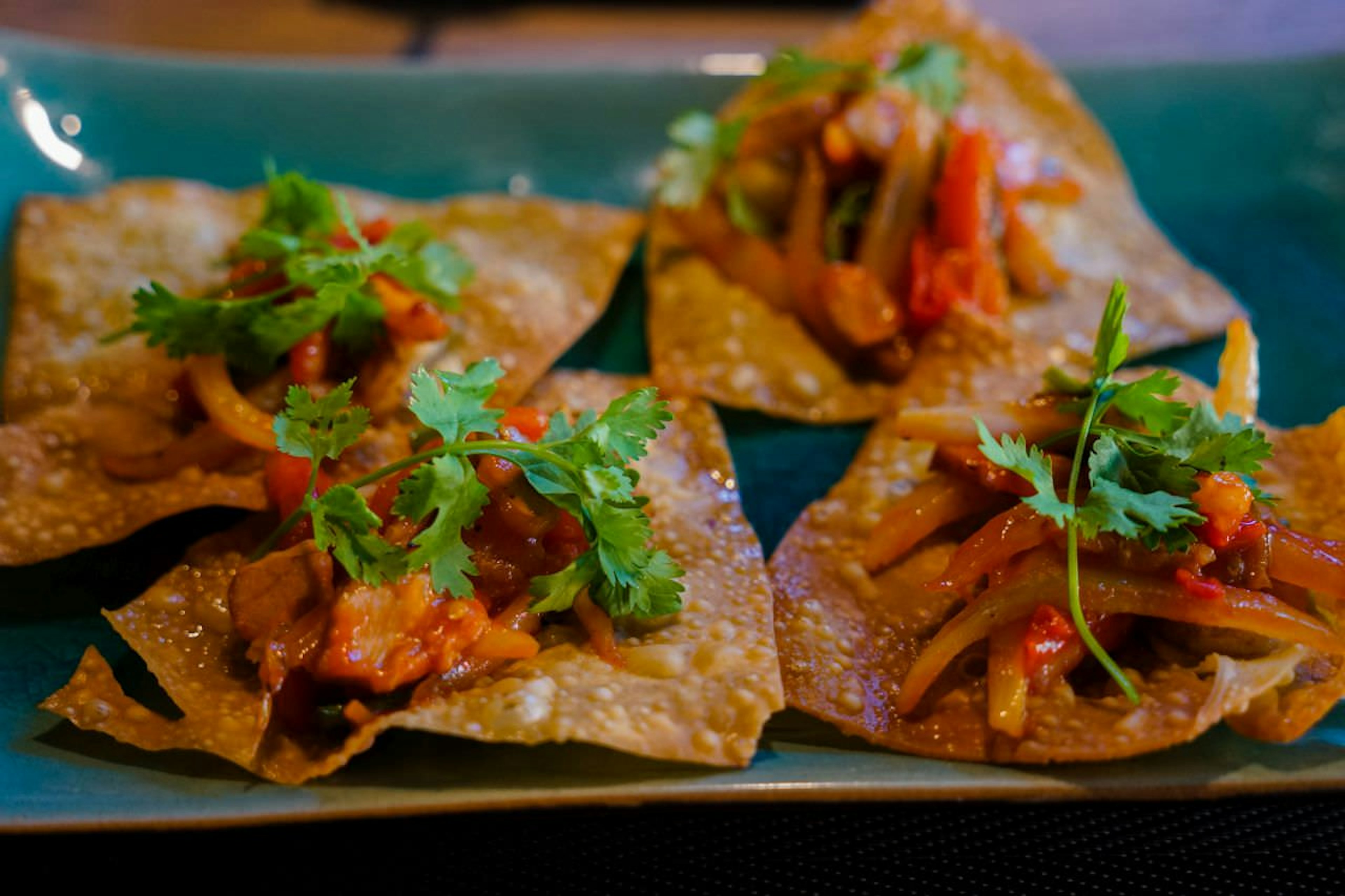 Hoi An's unusual take on wontons sees the dumplings wrapping fried and used as a base for pork, shrimp, peppers and onion