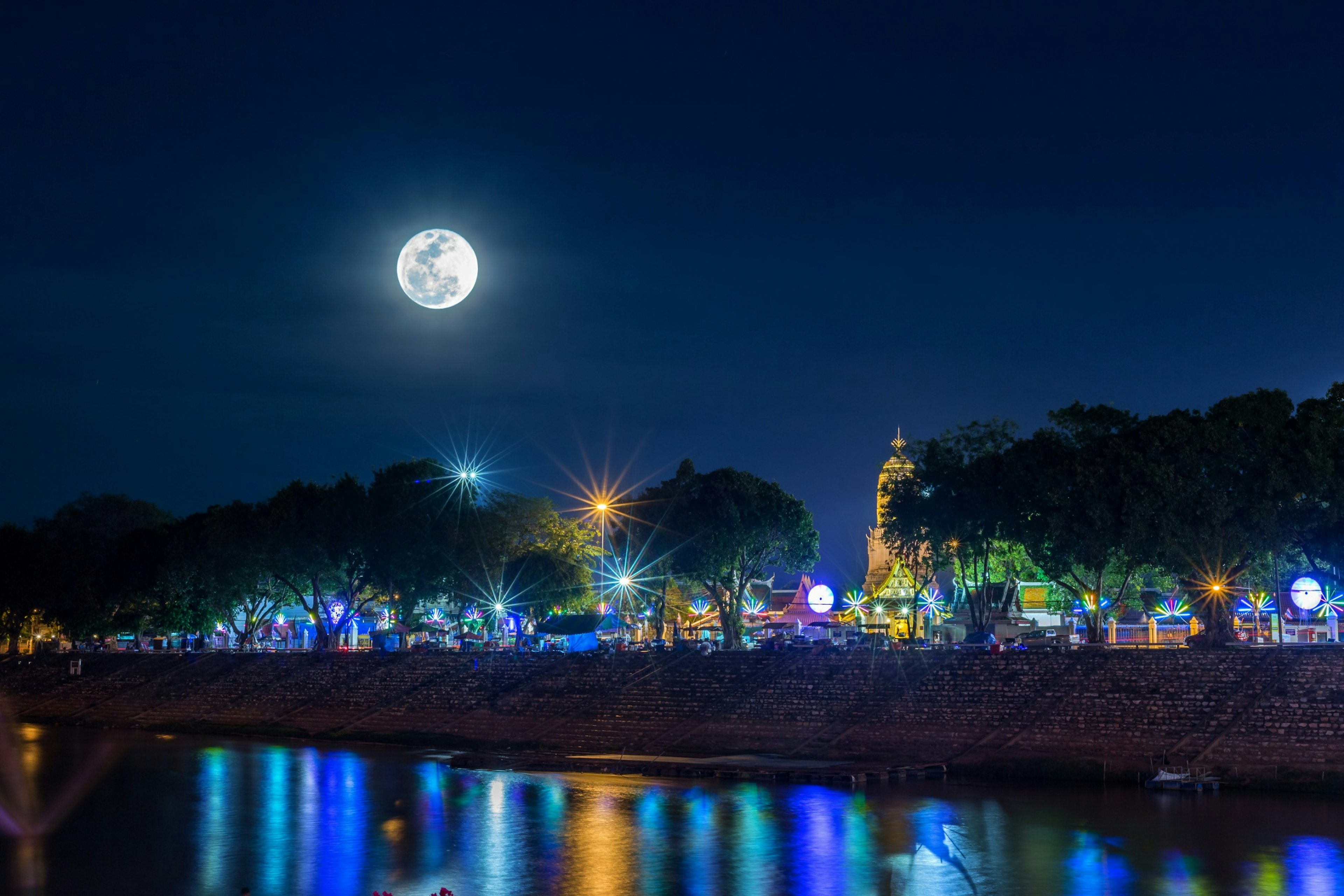 A full moon rising over the Re Island Bridge in Rivedoux